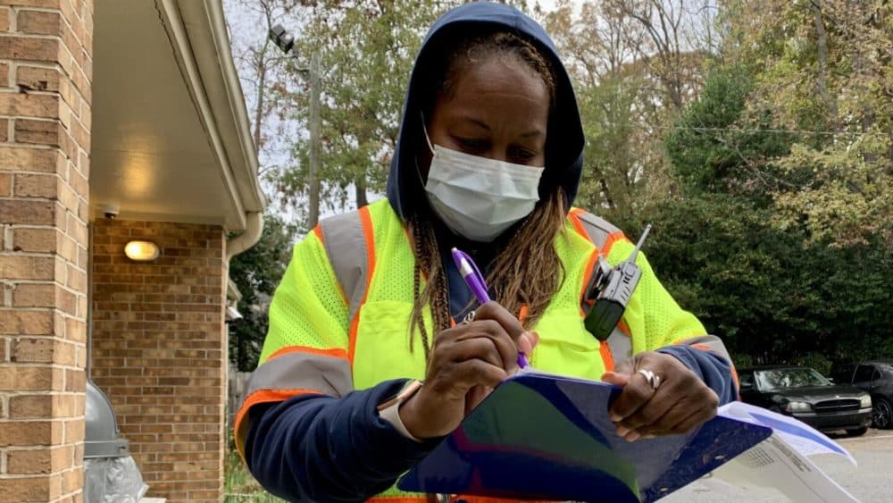 Feminist Women’s Health Center Operations Manager and security head Tracii Wesley prepares to greet patients outside the clinic. (Jess Mador/WABE)