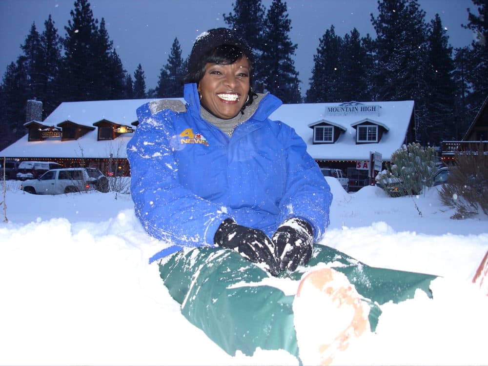 Beverly White sits in the snow. (Courtesy of Beverly White)