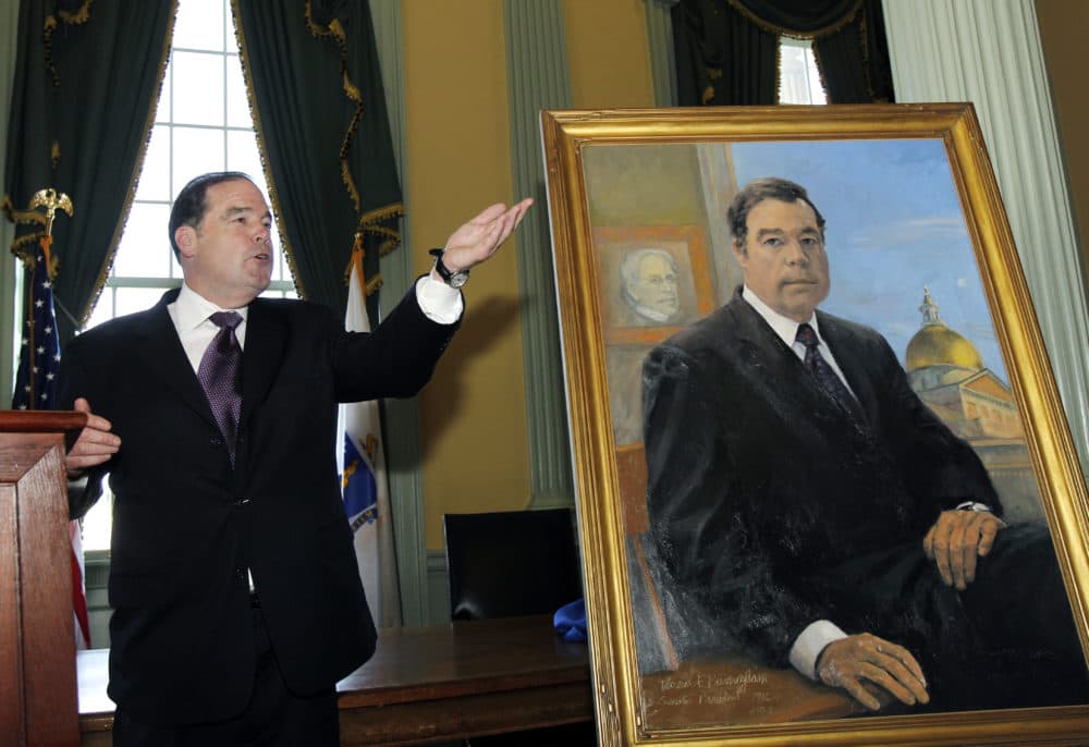 Former Massachusetts Senate President Thomas Birmingham of Chelsea, Mass. gestures as he unveils his official portrait at the Statehouse in Boston Thursday, May 12, 2011. The painting was done by artist George Nick of Concord, Mass. (AP Photo/Elise Amendola)