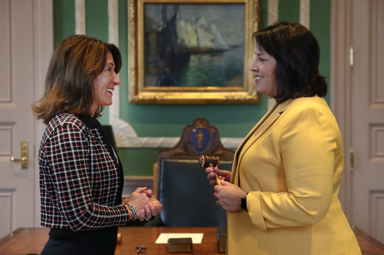 Lt. Gov. Karyn Polito and Lt. Gov. elect Kim Driscoll exchange a gavel at a ceremony at the Massachusetts State House. (Nancy Lane/Boston Herald via pool)