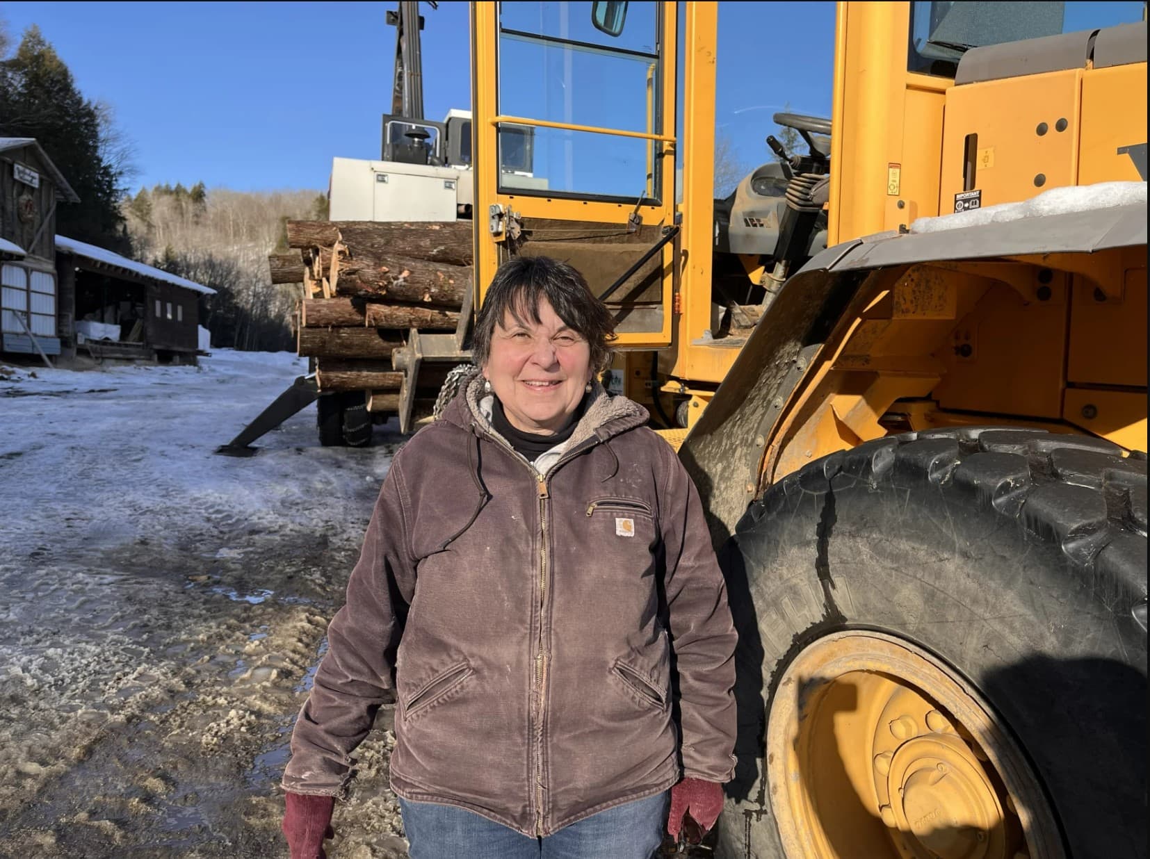 Colleen Goodridge, owner of Goodridge Lumber, is holding out hope that conditions will improve this winter, allowing loggers to harvest more wood. (Henry Epp/Vermont Public)