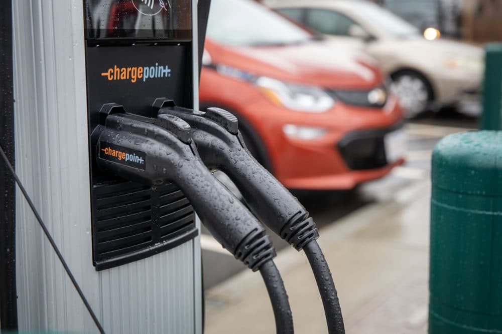 Electric car level 2 chargers in a parking lot in Jamaica Plain. (Credit: Robin Lubbock/WBUR)