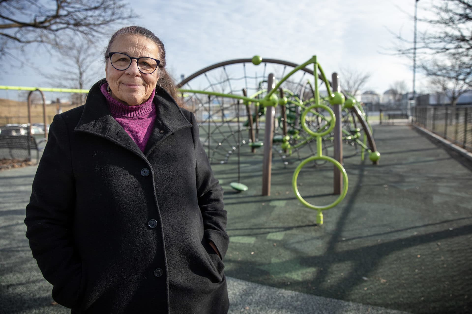 East Boston resident Debra Cave stands by the climbing frames at American Legion Playground. (Robin Lubbock/WBUR)