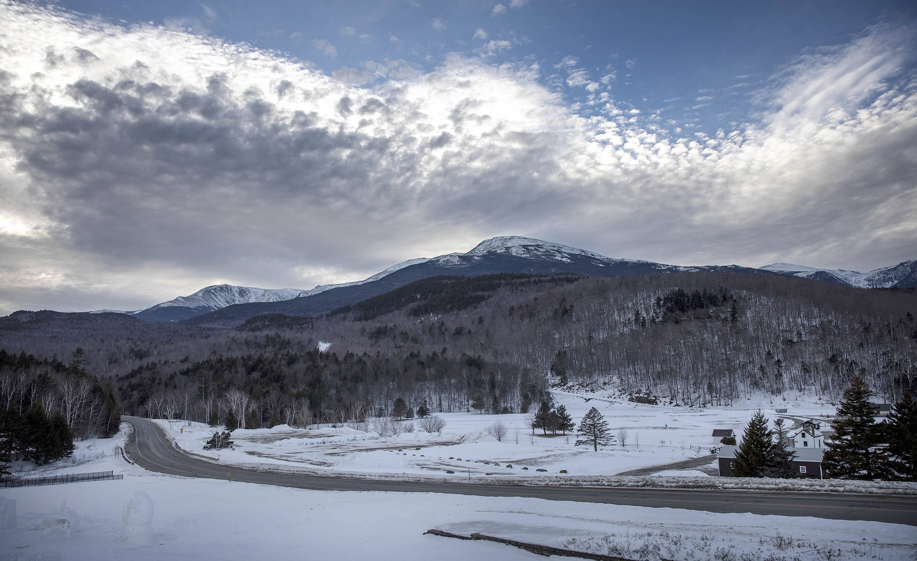Clouds gather over Mt. Washington in the late afternoon of a winter day in 2022. (Robin Lubbock/WBUR)