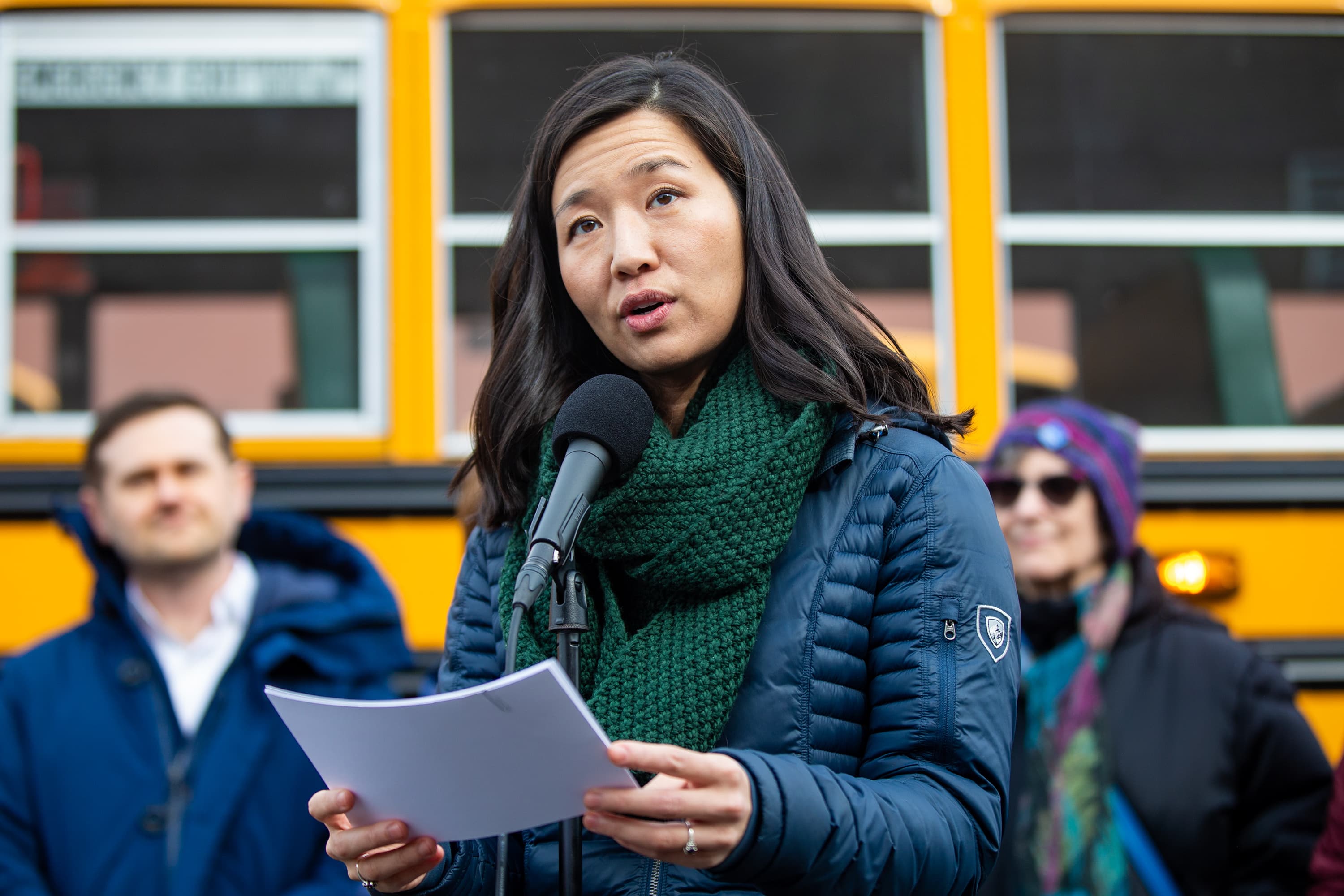 Mayor Michelle Wu announces the addition of 20 electric school buses to the Boston Public Schools' fleet during a press conference at the Readville Station Bus Yard in Hyde Park. (Jesse Costa/WBUR)