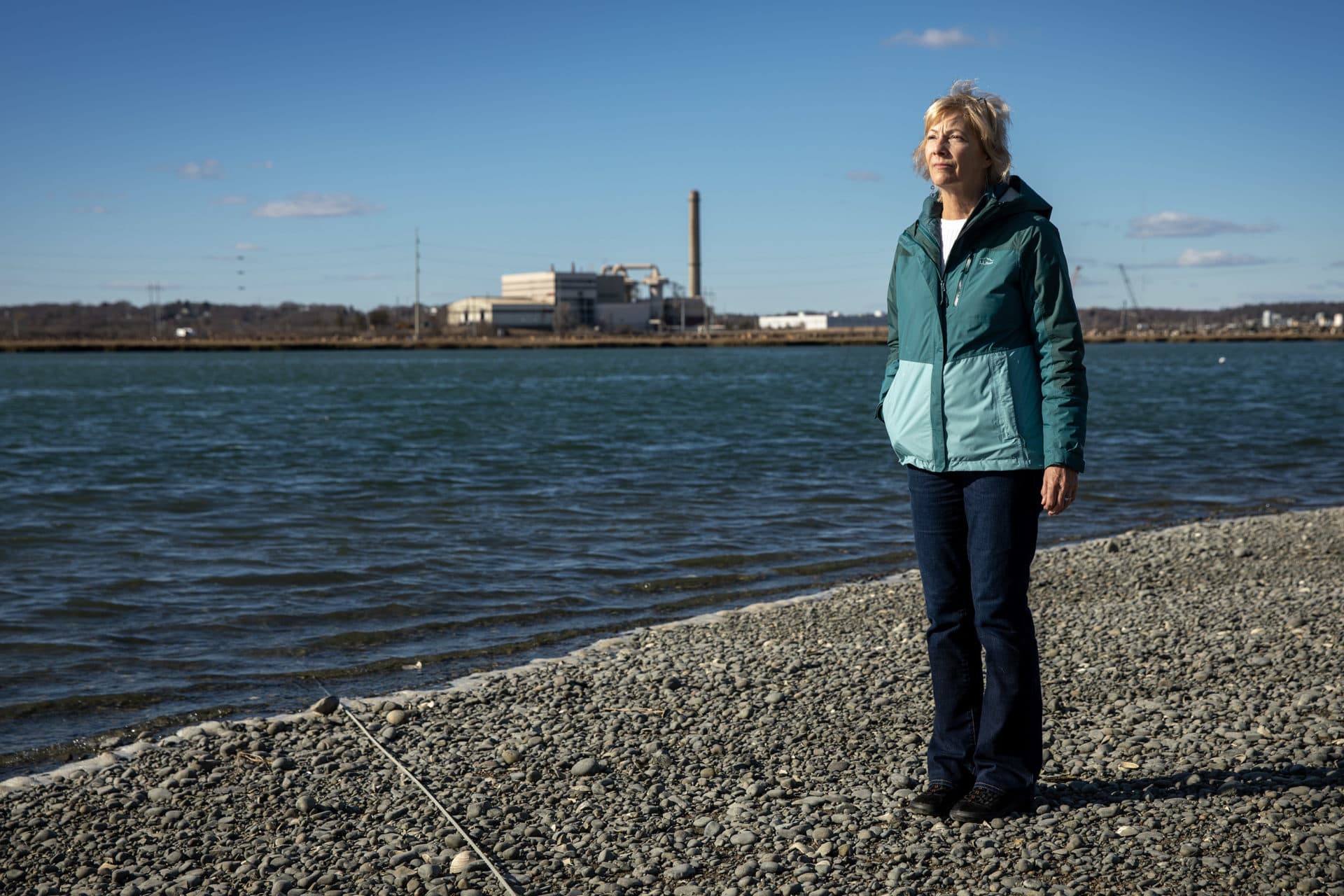 Loretta LaCentra stands near her home in Revere, across the Pines River from the Saugus incinerator and landfill. (Robin Lubbock/WBUR)