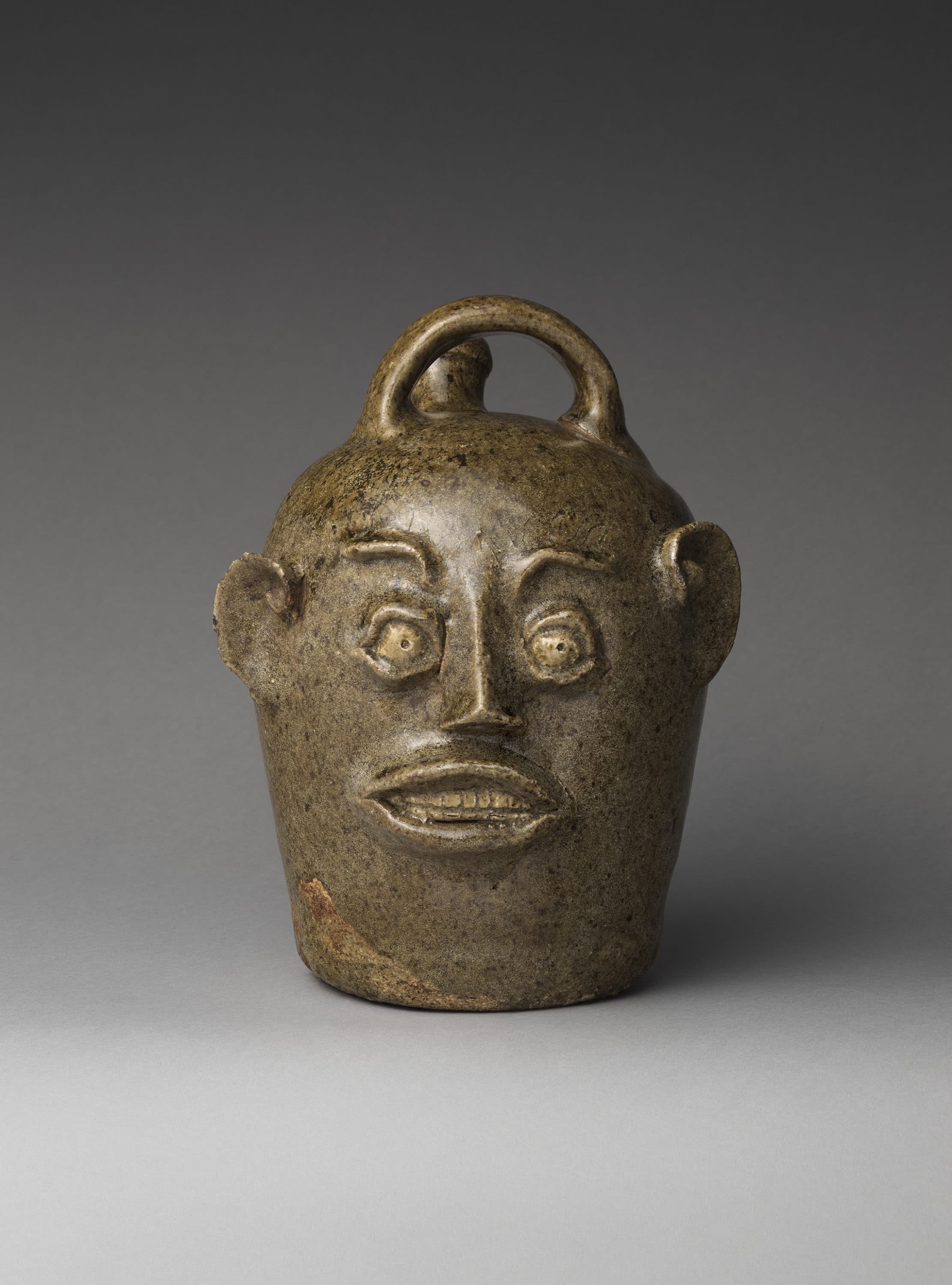 Unrecorded potter, "Face jug," 1850–1880. (Courtesy the Metropolitan Museum of Art, Purchase, Nancy Dunn Revocable Trust Gift, 2017 (2017.310); Museum of Fine Arts, Boston/Photo by the Metropolitan Museum of Art)