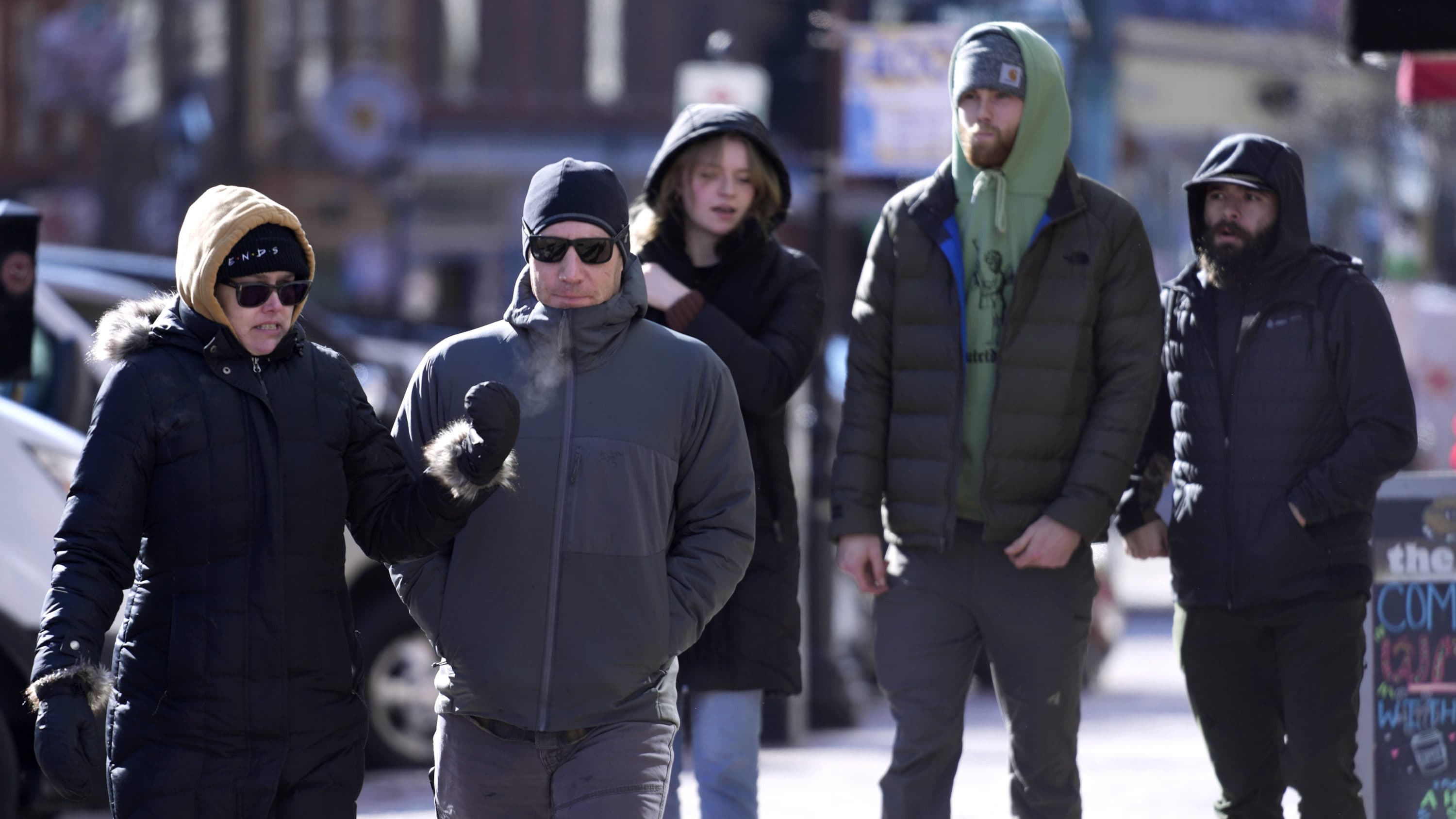 Pedestrians are bundled up in cold weather clothing while walking during a frigid weather snap, Friday, Feb. 3, 2023, in Portsmouth, N.H. (Charles Krupa/AP)