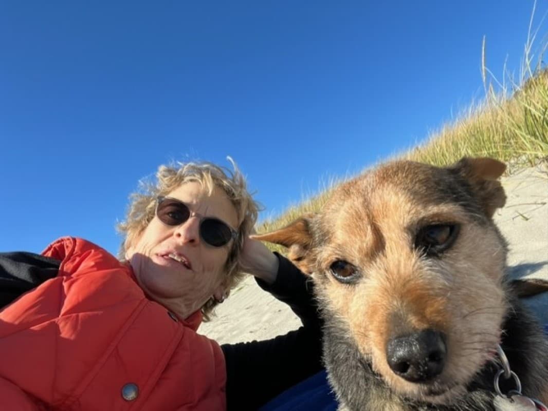 The author and Toby relaxing on Good Harbor Beach in Gloucester. (Courtesy Anita Diamant)