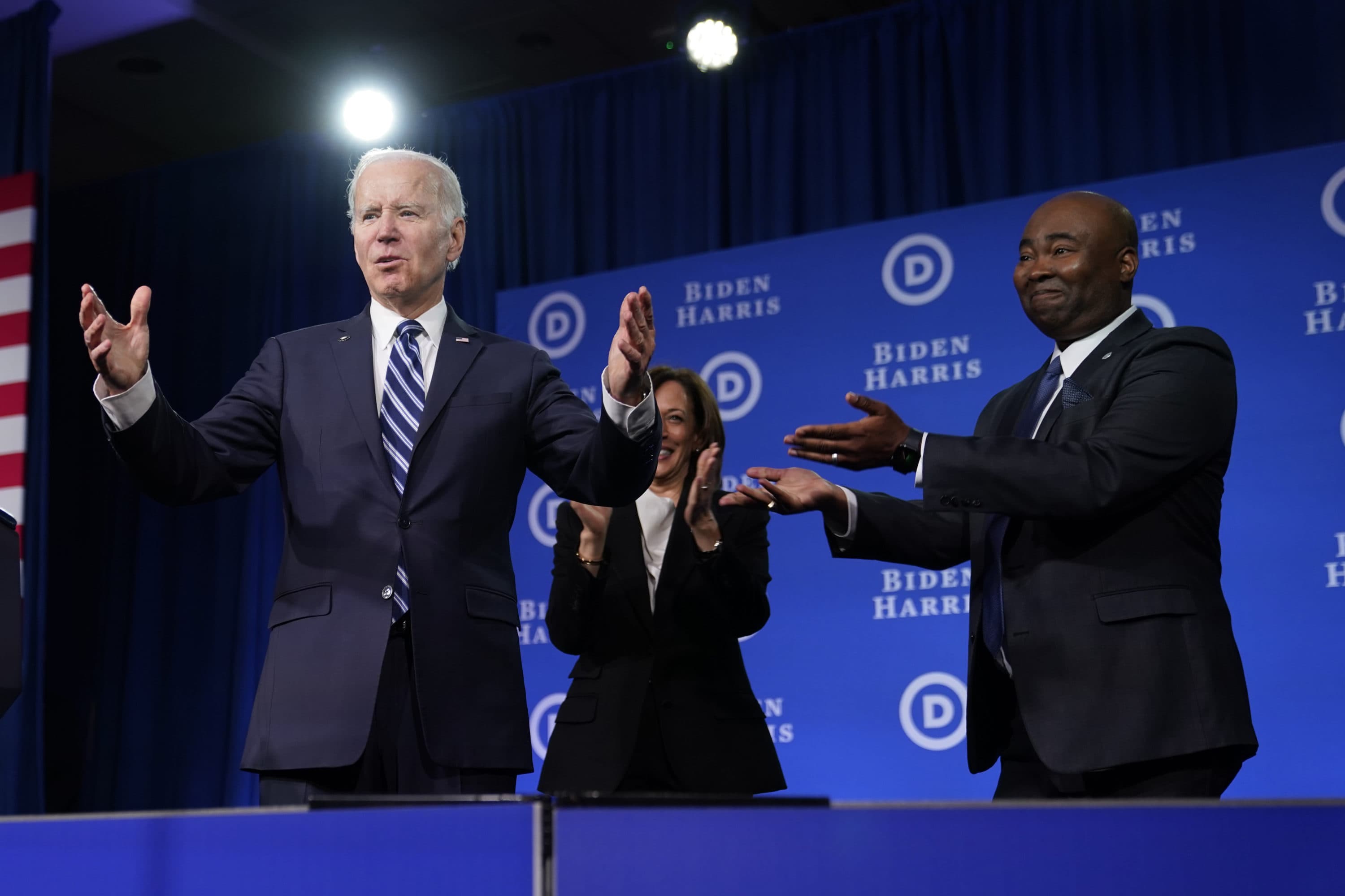 President Joe Biden and Vice President Kamala Harris stand on stage with DNC chair Jaime Harrison at the Democratic National Committee winter meeting on Feb. 3 in Philadelphia. (Patrick Semansky/AP)