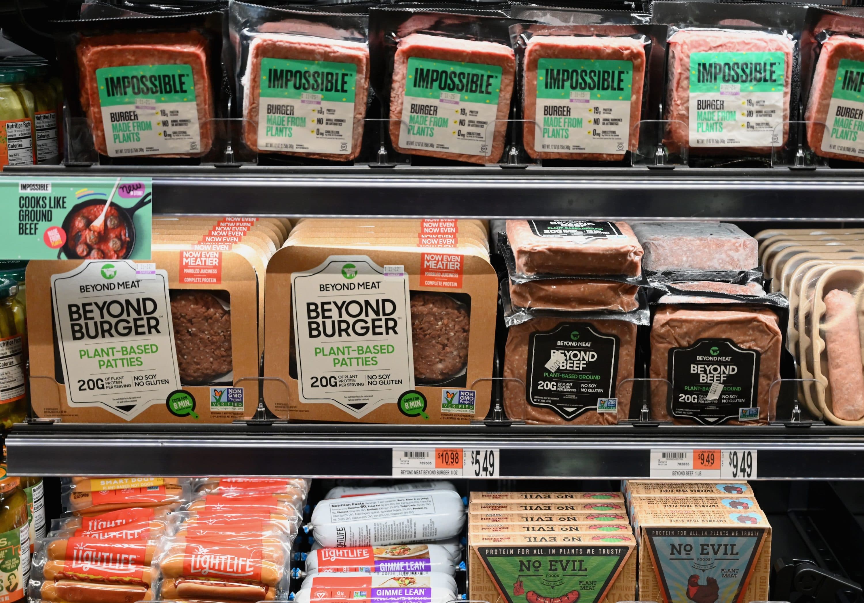 Packages of "Impossible Burger" and "Beyond Meat" sit on a shelf for sale in New York City. (Angela Weiss/AFP via Getty Images)