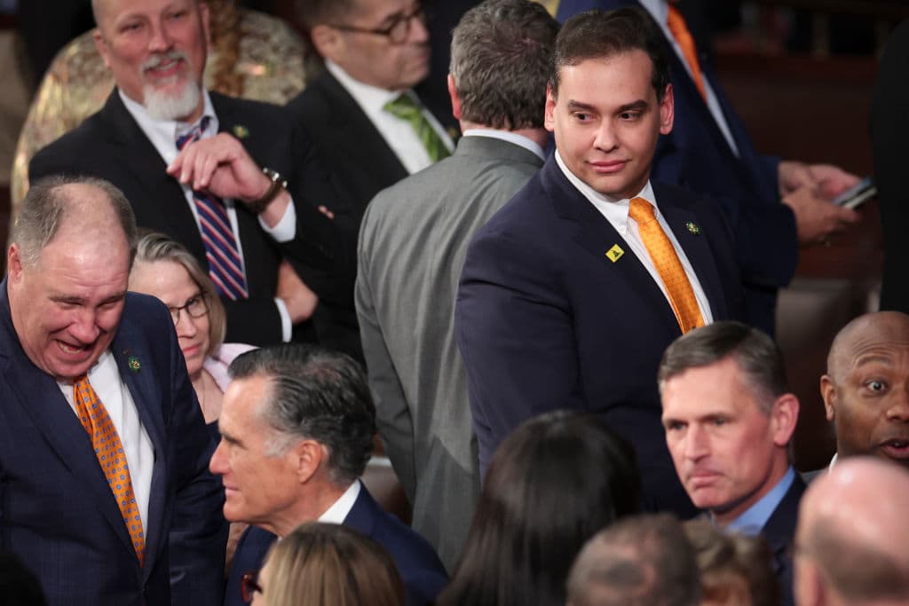U.S. Rep. George Santos (R-NY) (top right) watches as Sen. Mitt Romney (R-UT) (bottom left) enters the House chamber for President Joe Biden's State of the Union address during a joint meeting of Congress in the House Chamber of the U.S. Capitol on February 07, 2023 in Washington, DC. (Win McNamee/Getty Images)