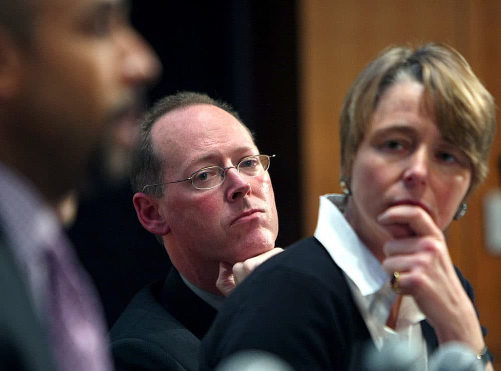 At a Harvard Medical School conference on Haiti with Partners in Health, Dr. Paul Farmer, center, and Ophelia Dahl, listen to panel member, Dr. David Walton speak about his experience in Haiti. (John Tlumacki/The Boston Globe via Getty Images)