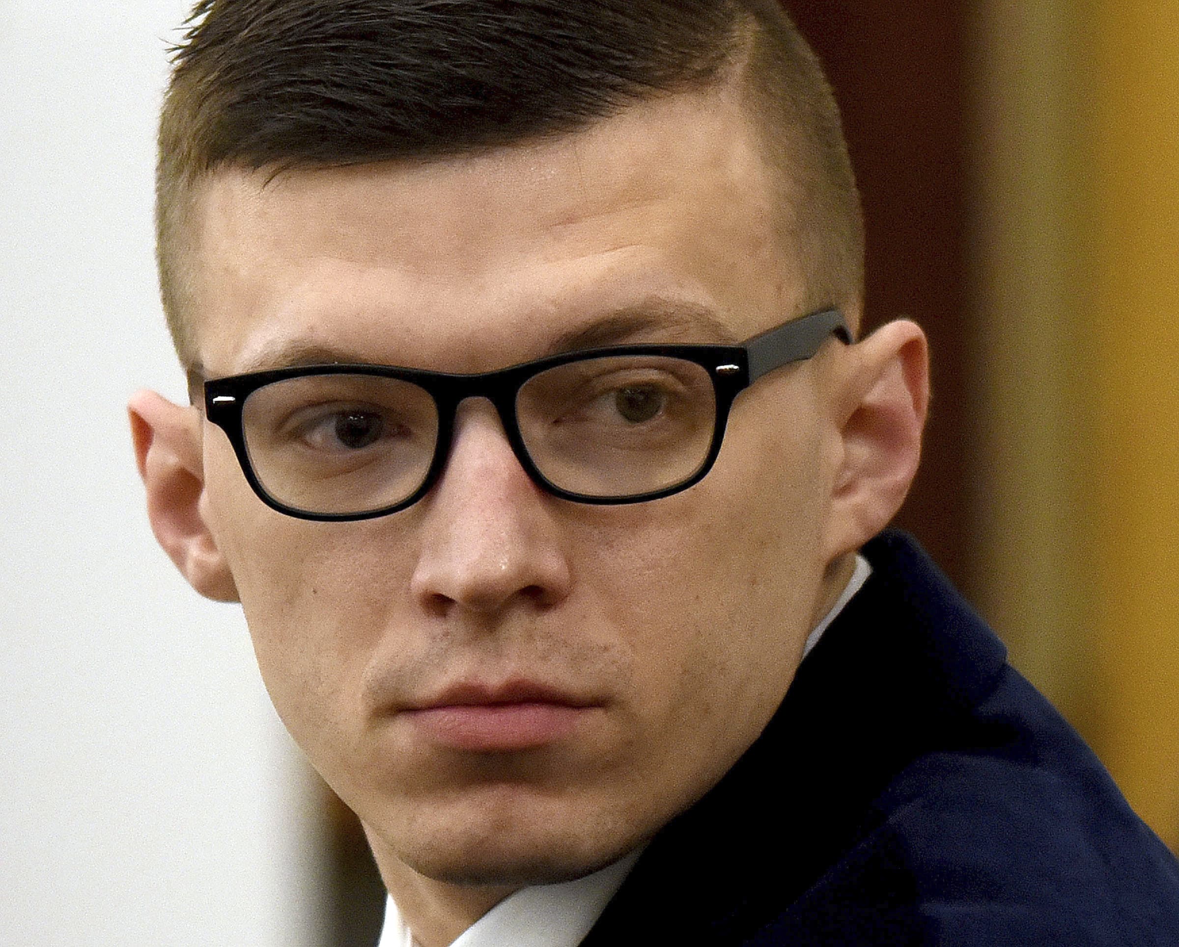 Volodymyr Zhukovskyy looks back at the gallery before closing statements started at his trial at Coos County Superior Court in Lancaster, N.H., Aug. 9, 2022. (David Lane/Union Leader via AP)