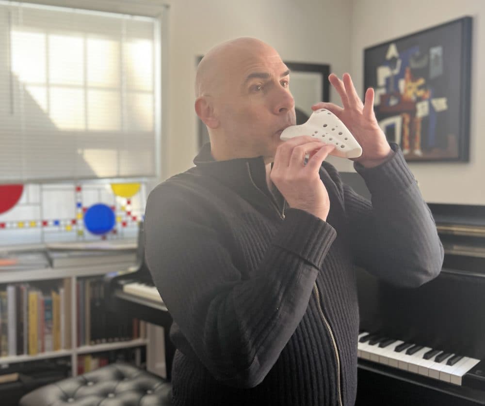 Eric Shinelonis plays the ocarina, a vessel flute that goes back thousands of years in South America. (Courtesy of Rebecca Sheir)