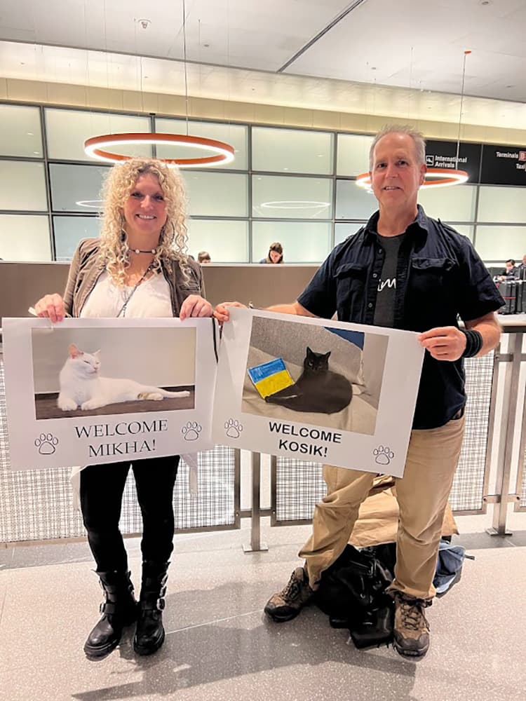 Jen Sundeen and John Calabria welcome Ira, Vlad, and Iryna to the US – including their cats. (Image via Welcome NST)