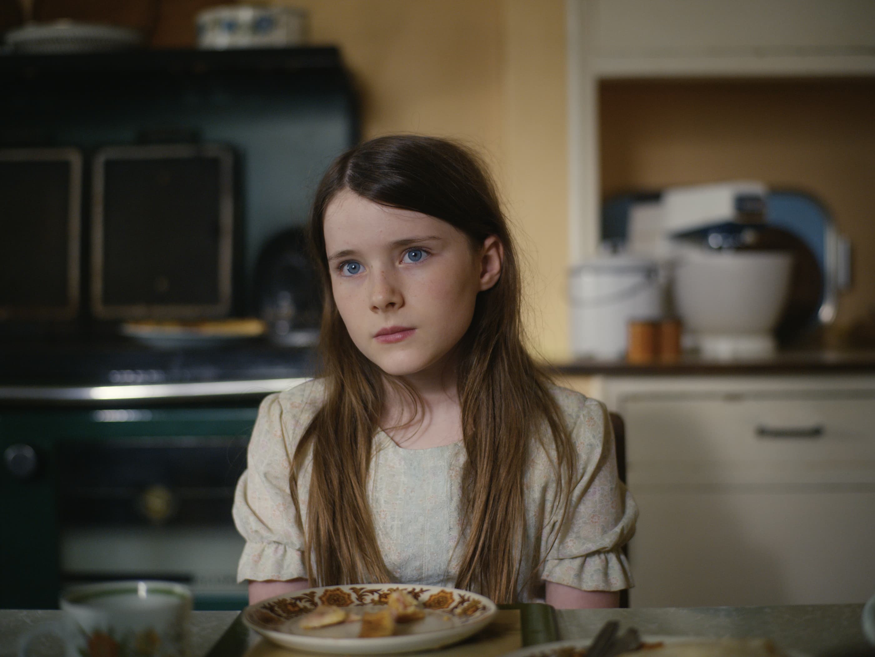Cáit, played by Catherine Clinch, studies the man of the house, Seán, in "The Quiet Girl." (Courtesy)