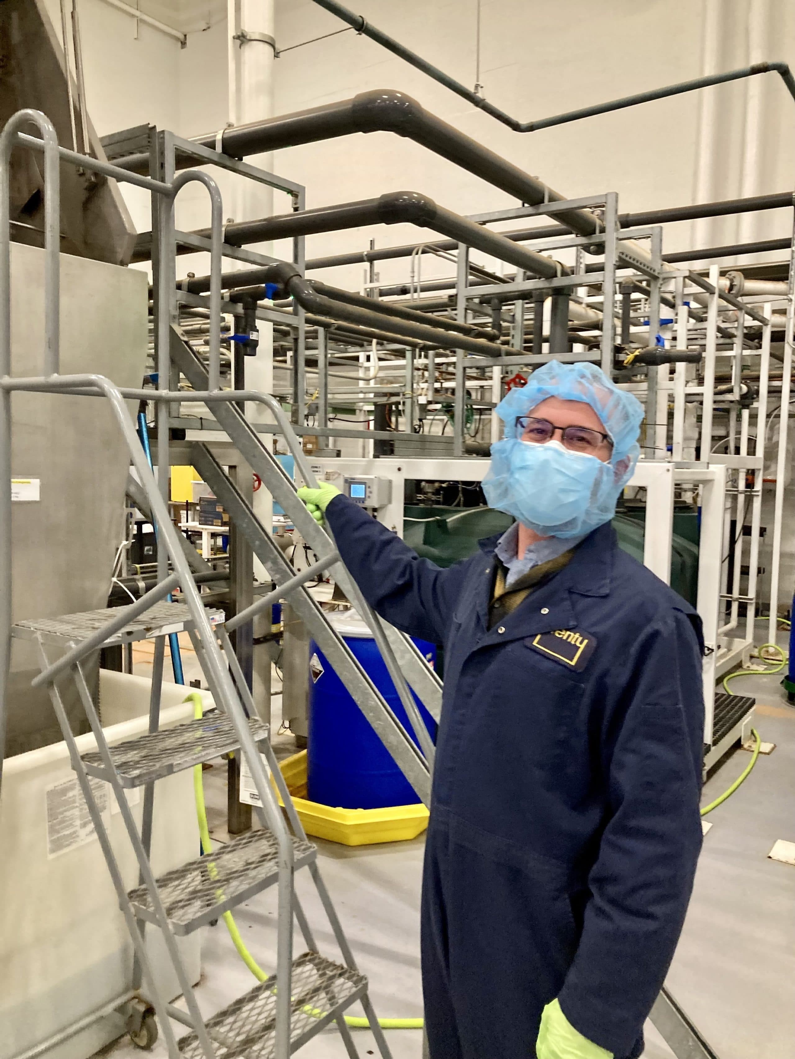 Plenty cofounder Nate Storey at the San Francisco farm’s water filtration system. By recycling water and capturing it from the air, the company says it can use 90 percent less water than traditional farms. (Peter O'Dowd/Here &amp; Now)