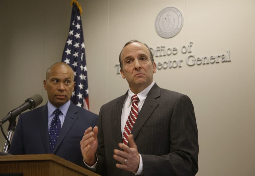 Massachusetts Inspector General Glenn Cunha releases the findings of his investigation of the Hinton Drug Lab at the offices of the Inspector General as Massachusetts Gov. Deval Patrick, left, looks on in 2014. (Stephan Savoia/AP)