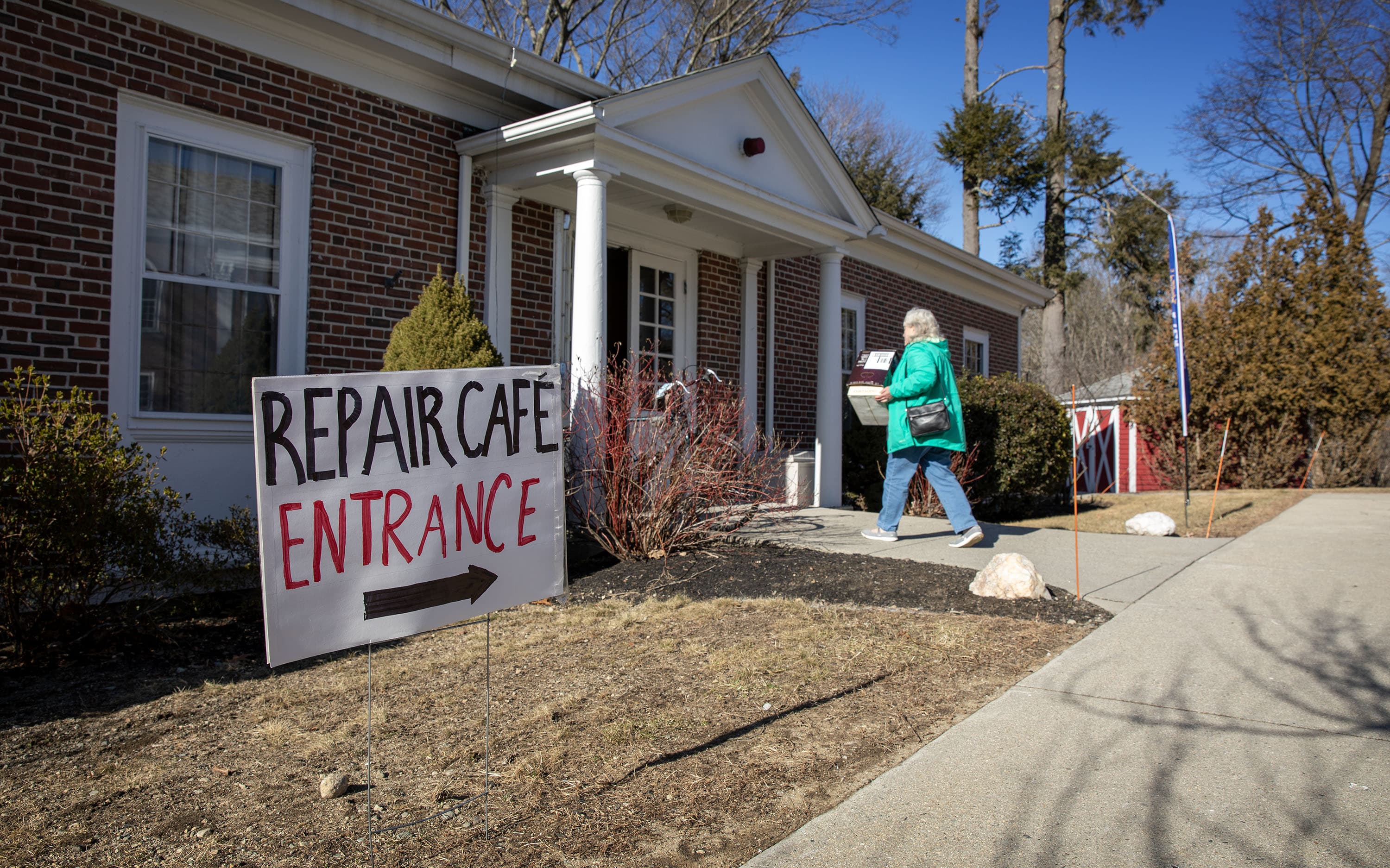 A customer walks into the Repair Cafe at First Parish church in Framingham. (Robin Lubbock/WBUR)