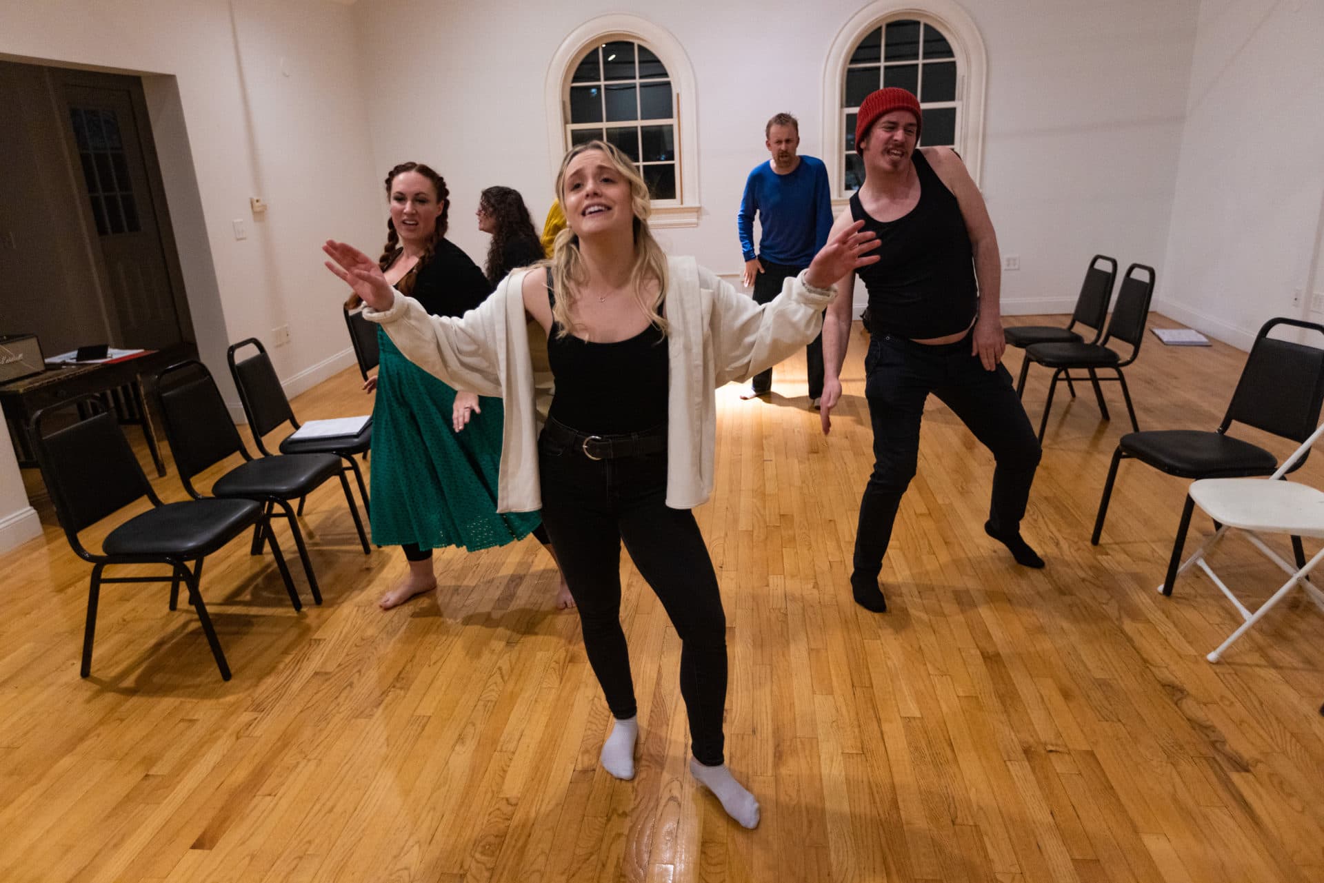 The cast of “T: An MBTA Musical” rehearse at The Center for Arts at the Armory in Somerville ahead of their new season of shows beginning in March at the Rockwell in Davis Square. (Jesse Costa/WBUR)