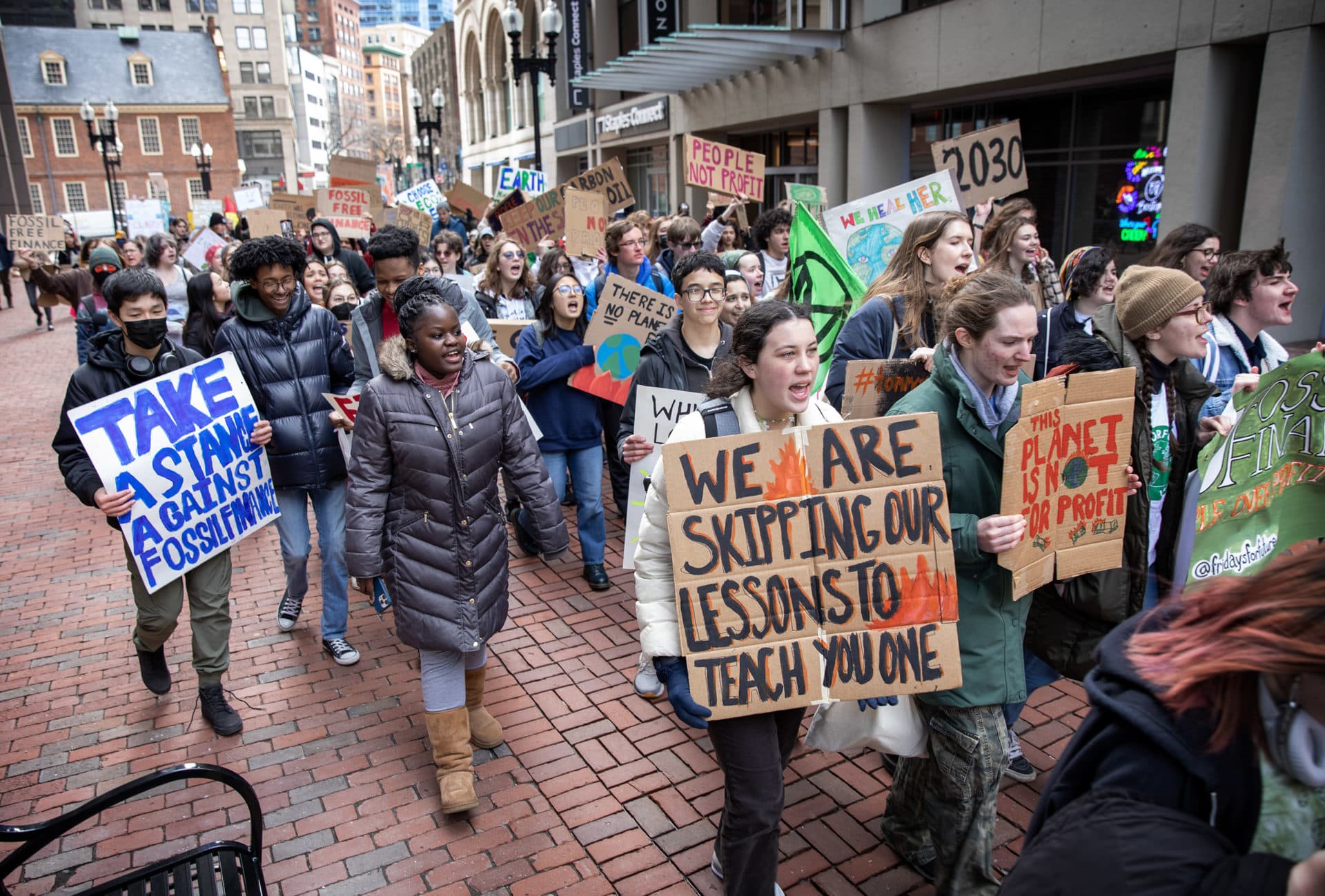 Fridays For Future protesters march through downtown Boston demanding a halt to all investment in fossil fuels. (Credit: Robin Lubbock/WBUR)