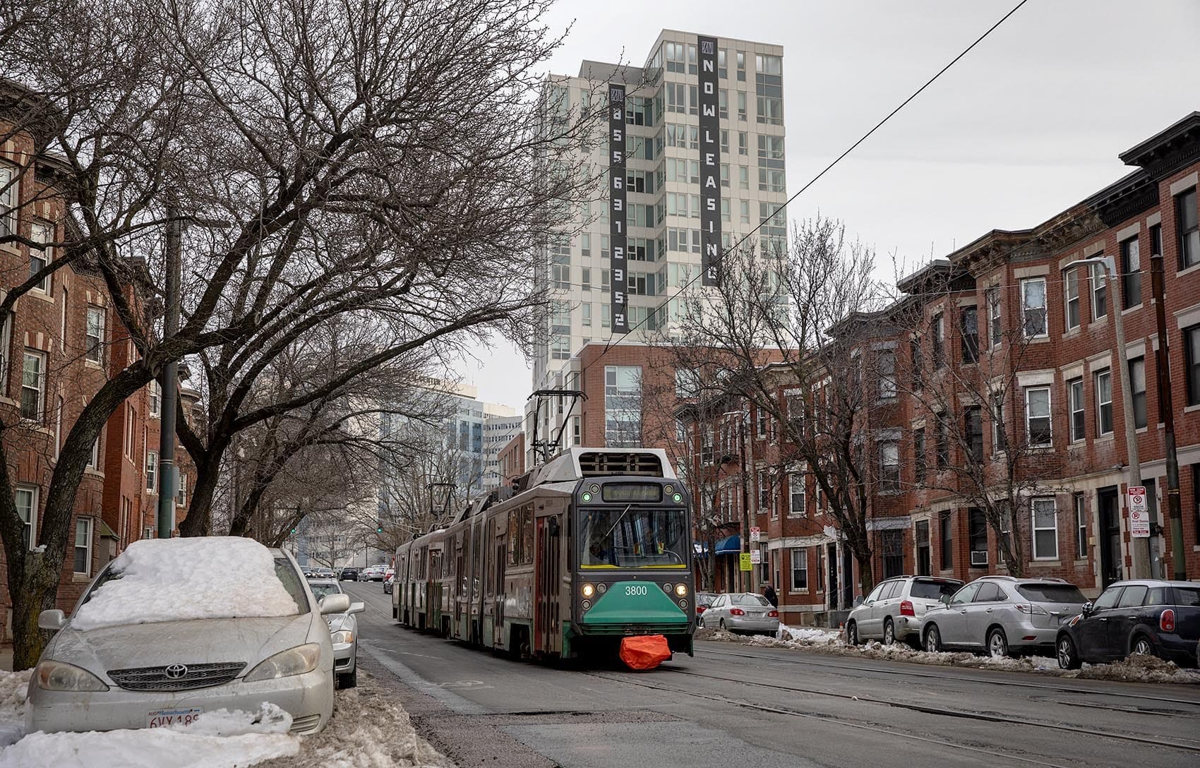 A new apartment building by the Green Line on Huntington Ave. (Robin Lubbock/WBUR)