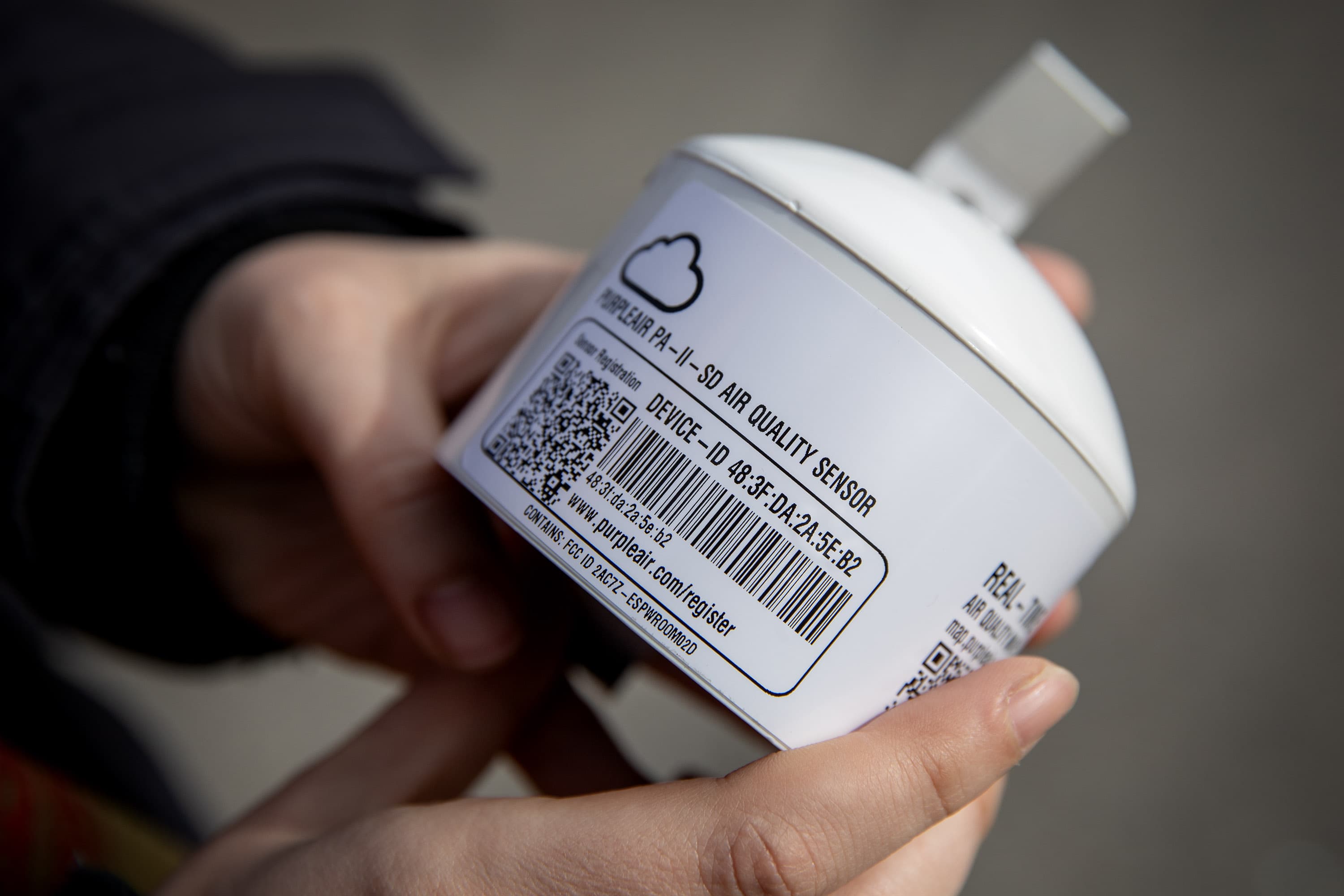 A Purpleair air quality sensor, which can monitor air quality and display the information on map as it happens. (Robin Lubbock/WBUR)