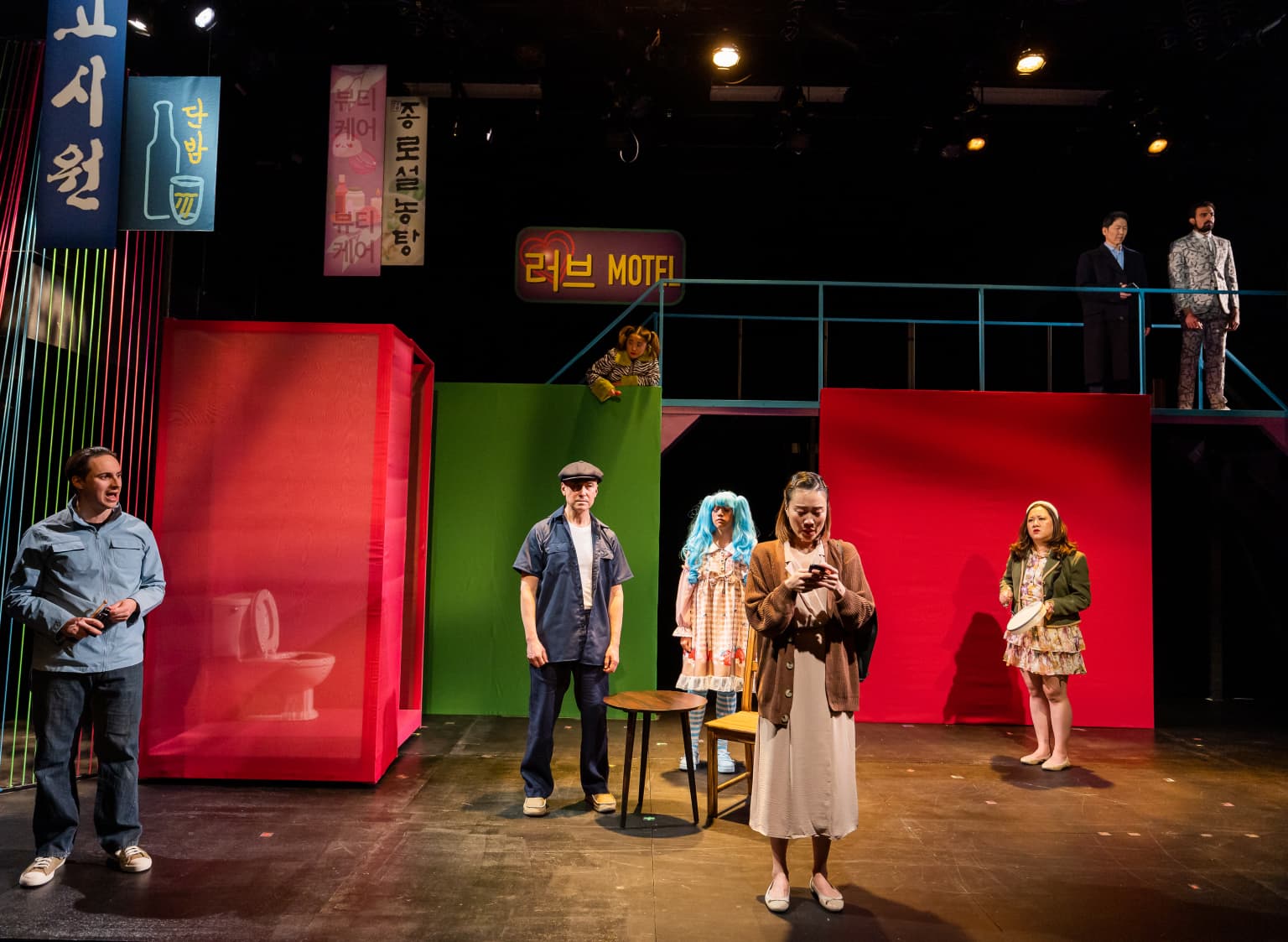 From left: Ryan Mardesich, John D. Haggerty, Amanda Centeno (background, on railing),Ciaran D’Hondt, Eunji Lim, Elaine Hom, Jeffrey Song and Fady Demian in SpeakEasy Stage's "Wild Goose Dreams." (Courtesy Nile Scott Studios)