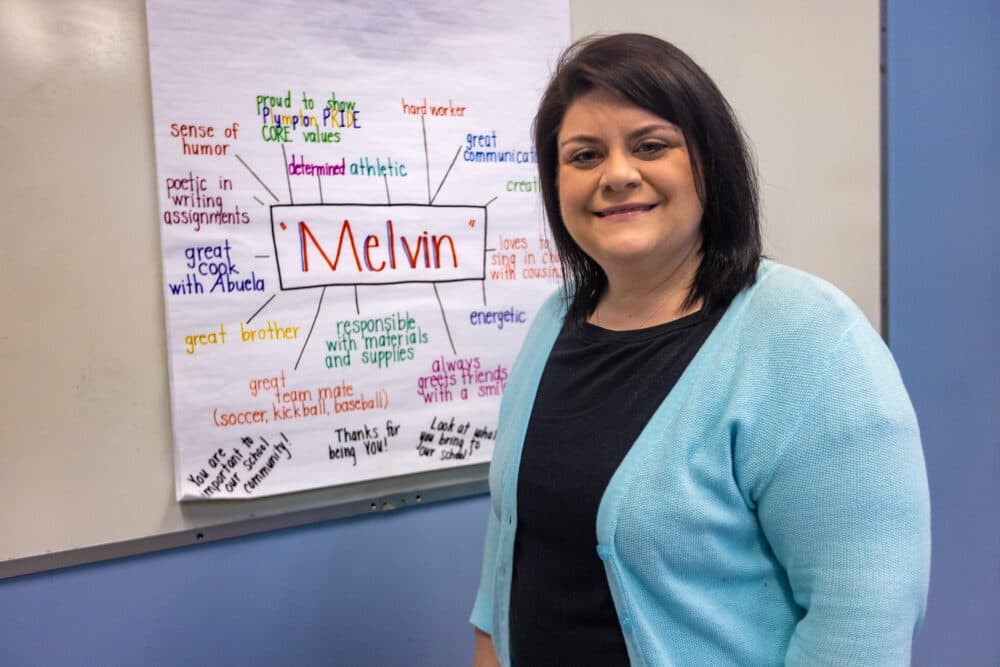 Special education teacher Meredith Lee stands in front of an example of a &quot;strength mapping&quot; poster that she makes during IEP meetings at Plympton Elementary School in Waltham. (Jesse Costa/WBUR)