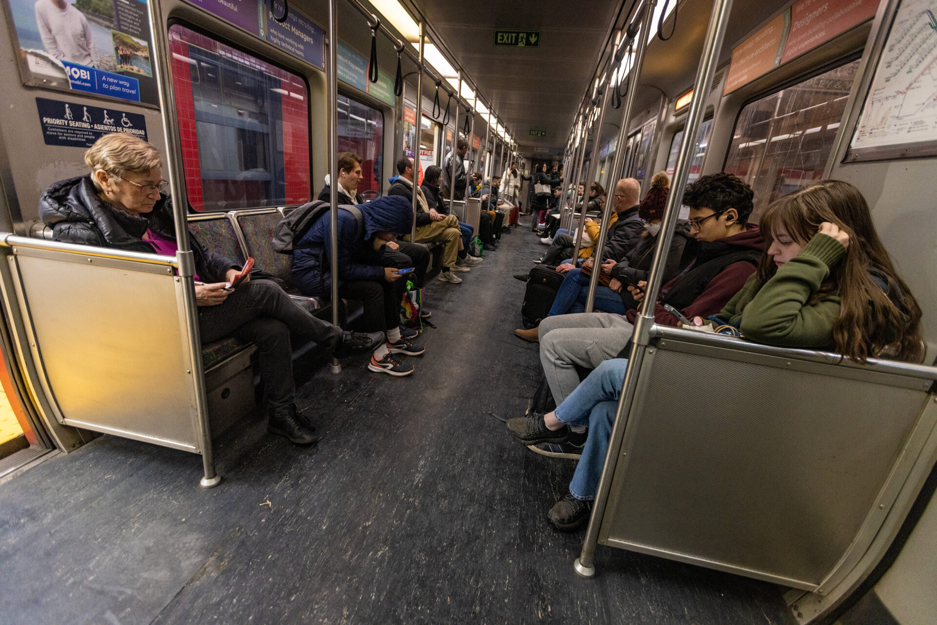 Riders sit and wait for a Red Line train to leave Park Street station. (Jesse Costa/WBUR)