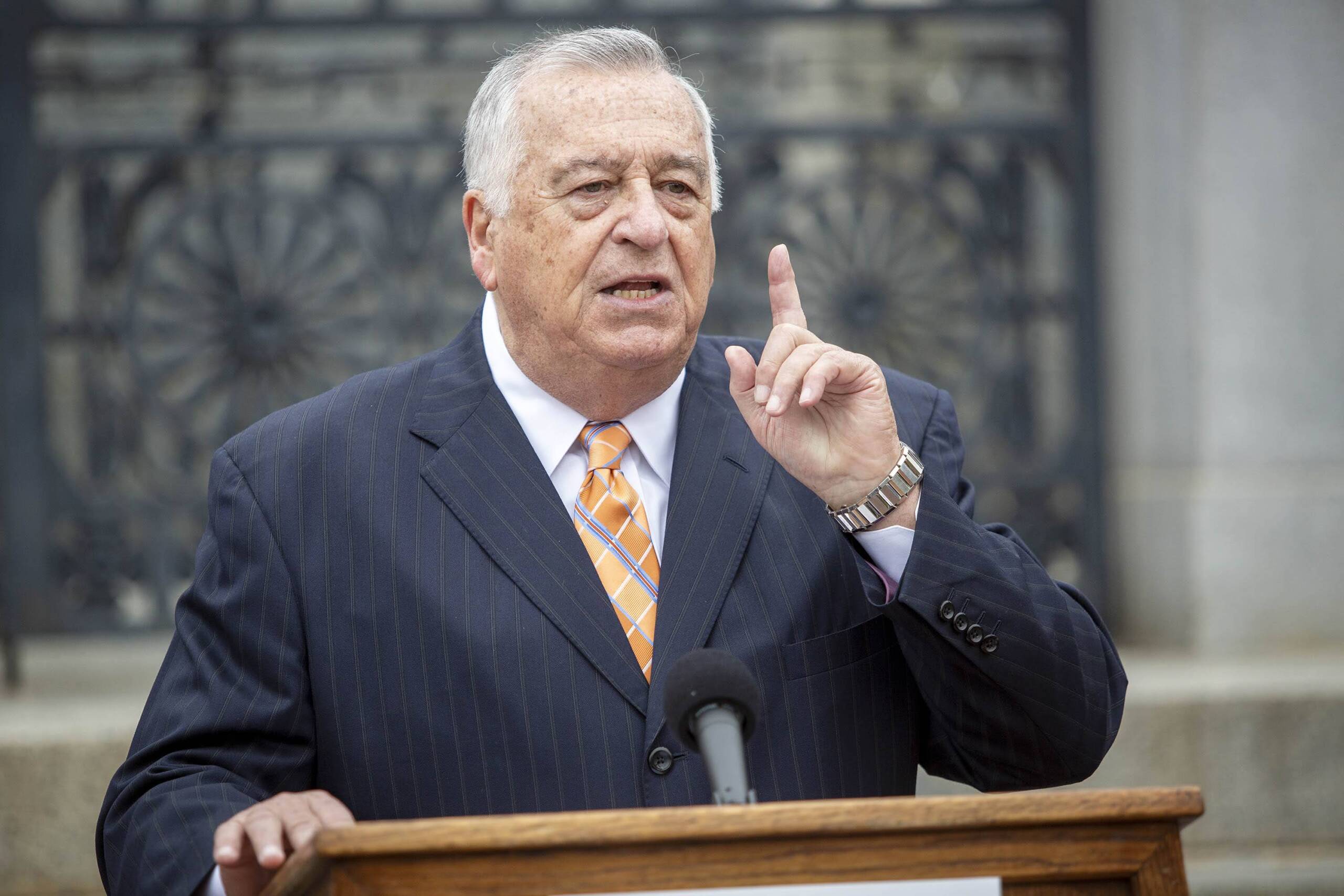 House Speaker Ron Mariano speaks to reporters on the steps of the Massachusetts State House. (Robin Lubbock/WBUR)