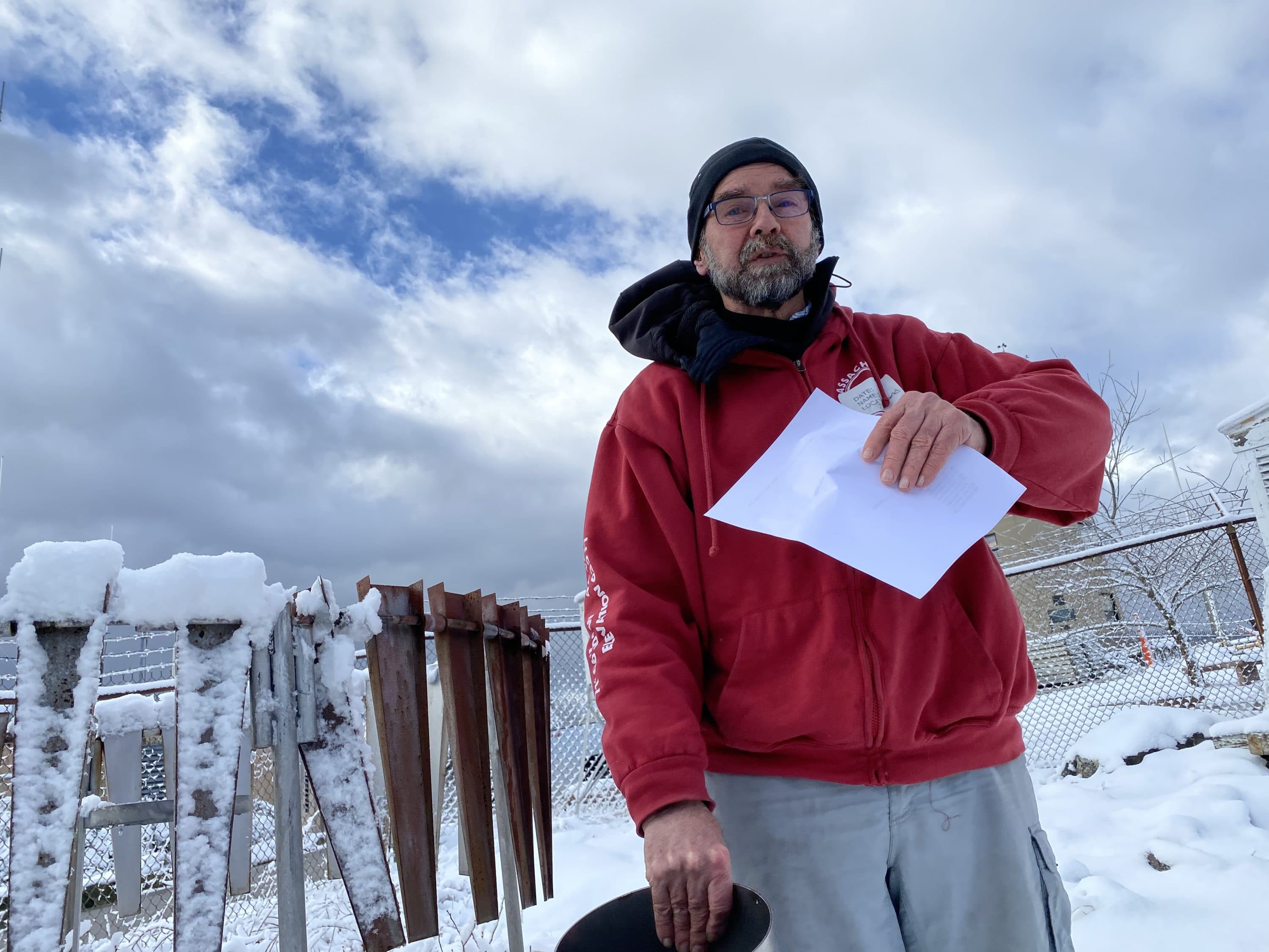 Weather observer and teacher Don McCasland shows a device for measuring precipitation. (WBUR/Simón Rios)