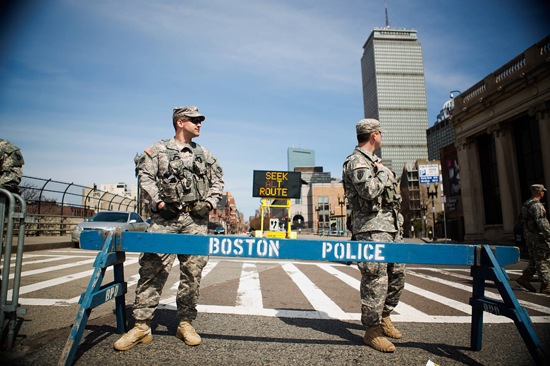 Army National Guardsmen stand at a barricade at the corner of Massachusetts Avenue and Boylston Street the day after the bombings. (Jesse Costa/WBUR)