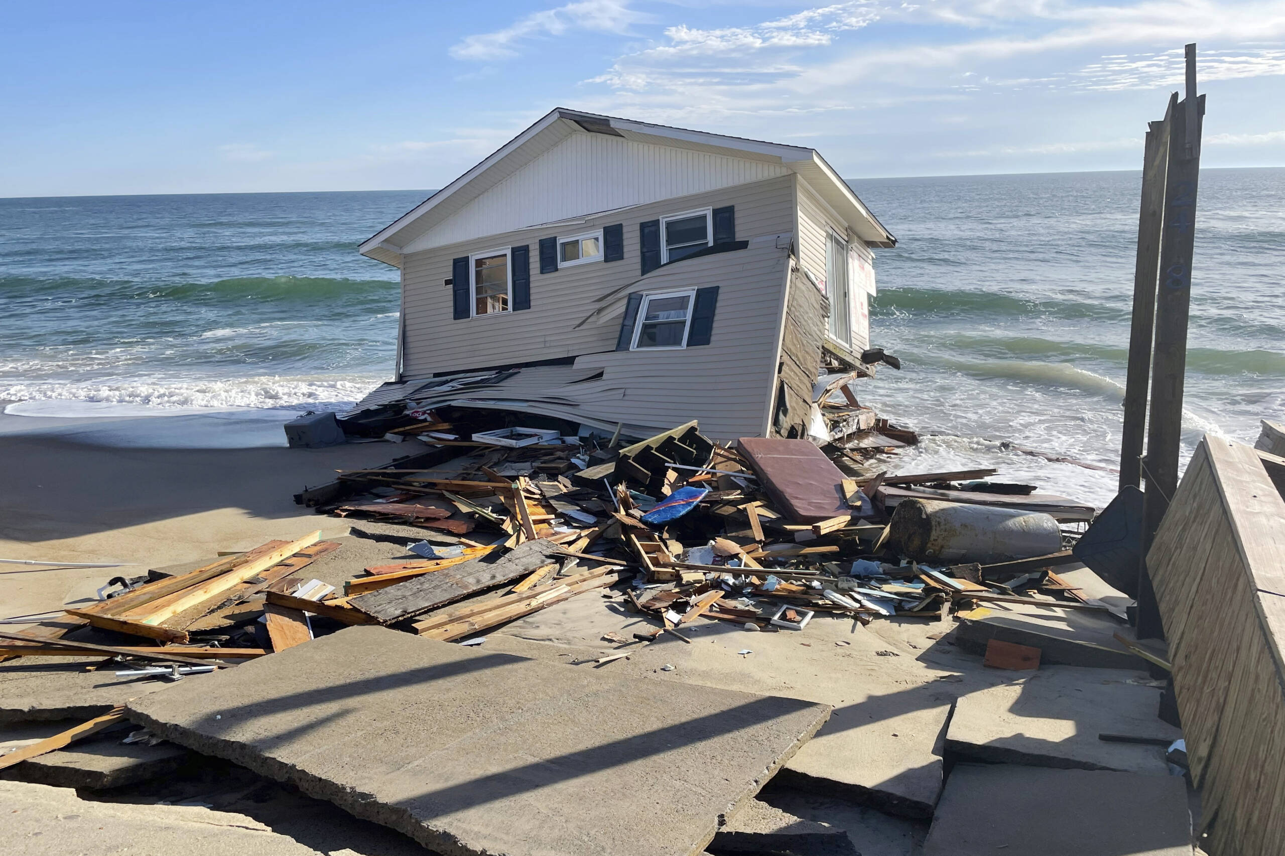 This image released by the National Park Service, shows a collapsed beachfront home along Ocean Drive in Rodanthe, N.C., on Wednesday, Feb. 9, 2022. (National Park Service via AP)