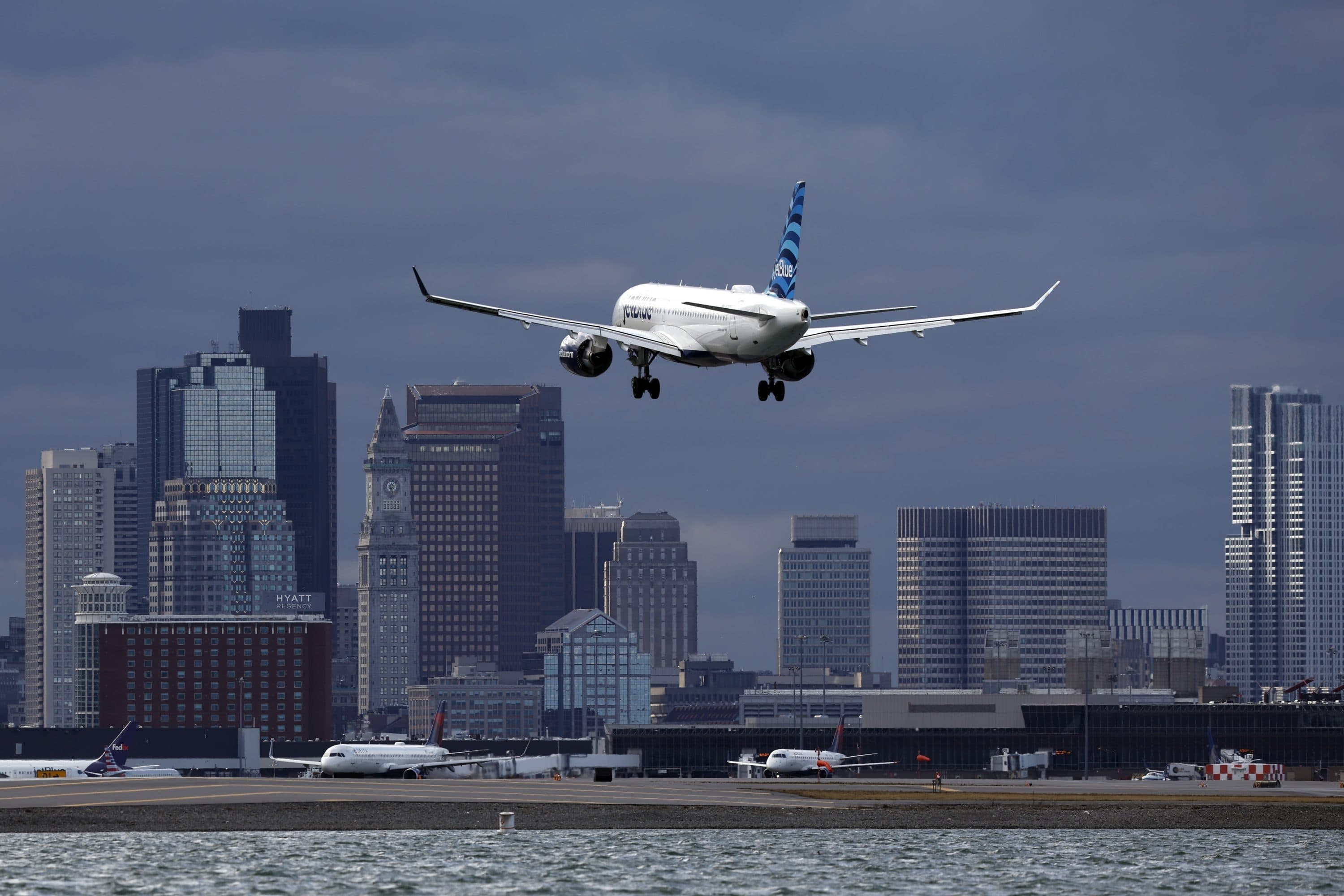 A JetBlue plane lands at Logan International Airport, Thursday, Jan. 26, 2023, in Boston. (Michael Dwyer/AP)