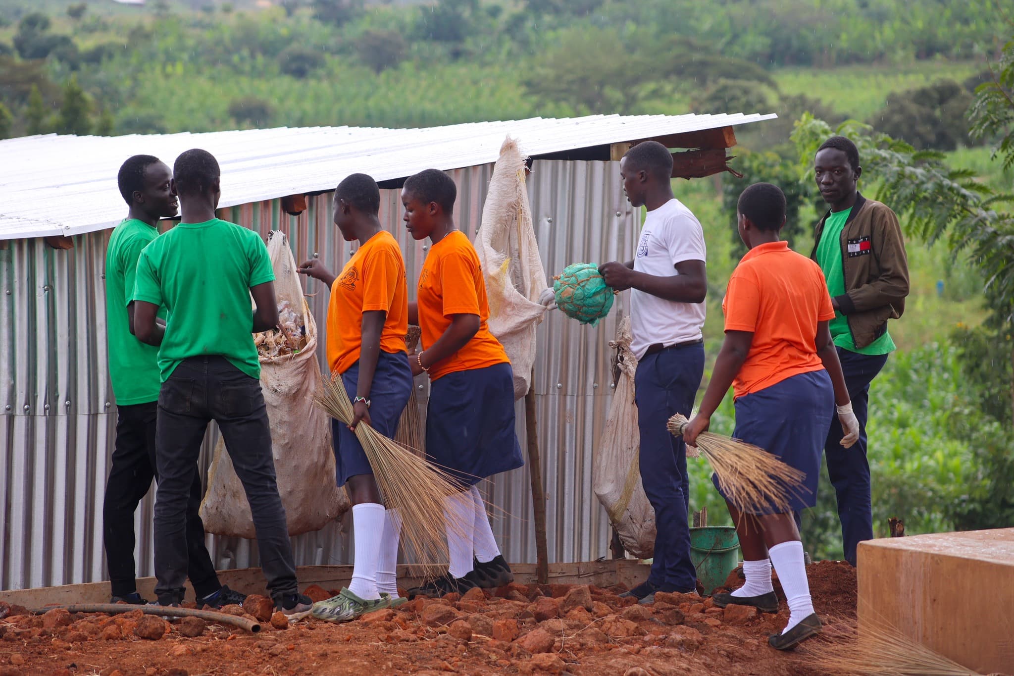 Students at the Kyangwali refugee camp In Uganda work on a waste management project. (Courtesy COBURWAS International Youth Organization to Transform Africa (CIYOTA))