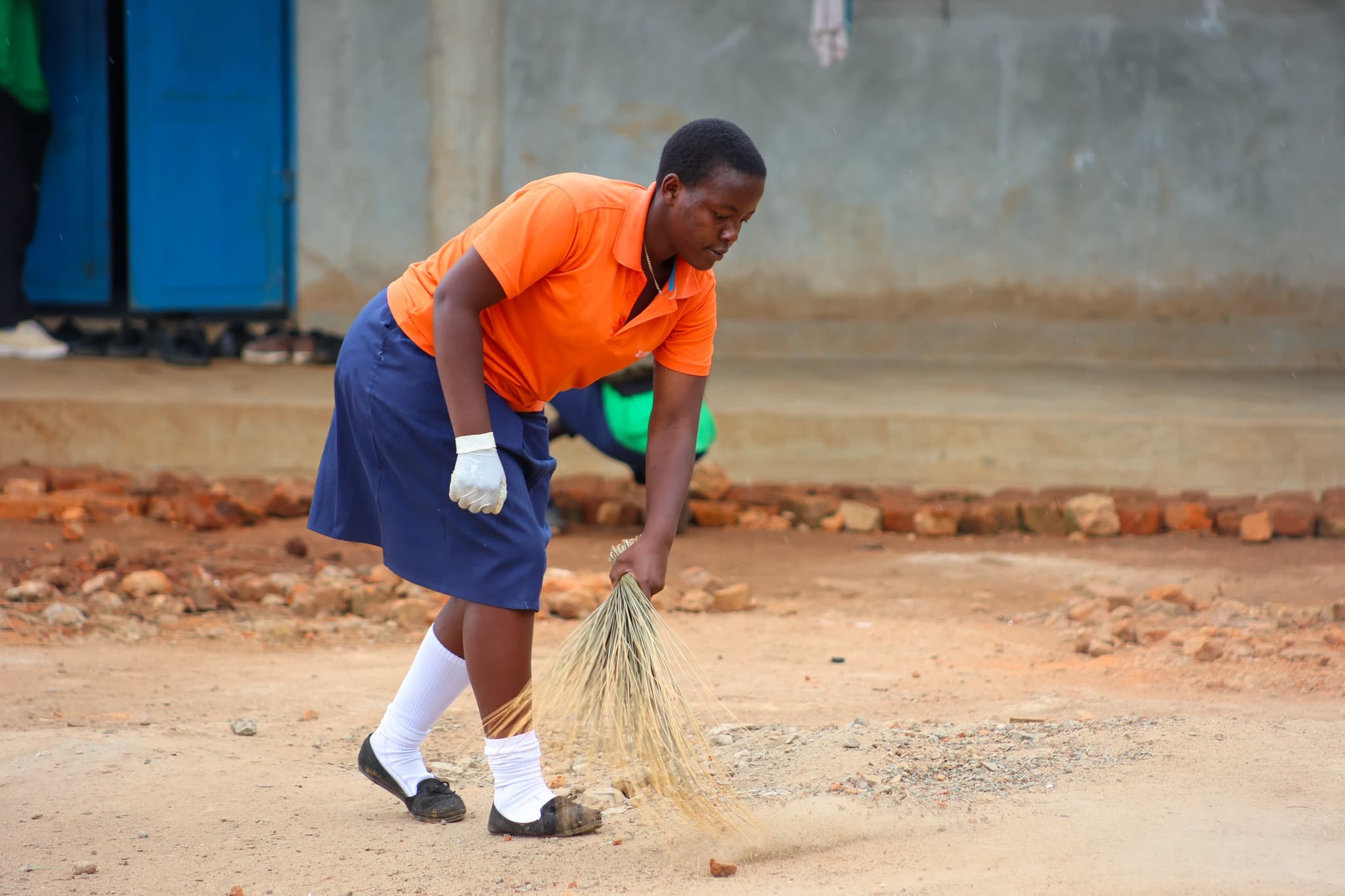 A student at the Kyangwali refugee camp In Uganda works on a waste management project. (Courtesy COBURWAS International Youth Organization to Transform Africa (CIYOTA))