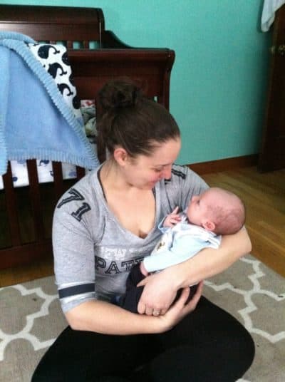Ashley Healy with her first child, then 1 month old, on Feb. 8, 2015. "I was still very much struggling with postpartum depression (though you wouldn't know it from the photo)," she says. (Courtesy Ashley Healy)