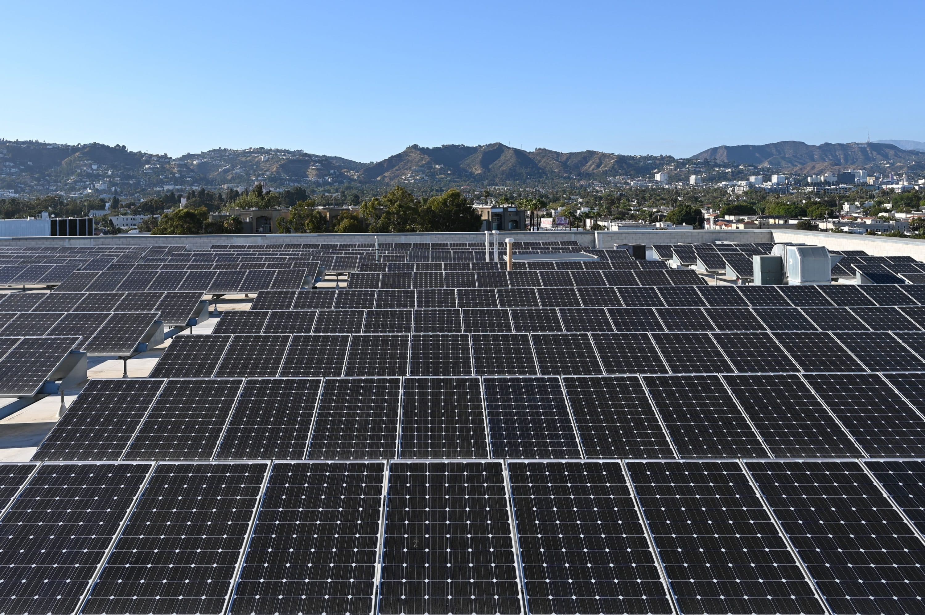 Solar panels are seen on the roof of a building in Los Angeles, California, on June 18 2022. (Photo by Daniel Slim/AFP via Getty Images)