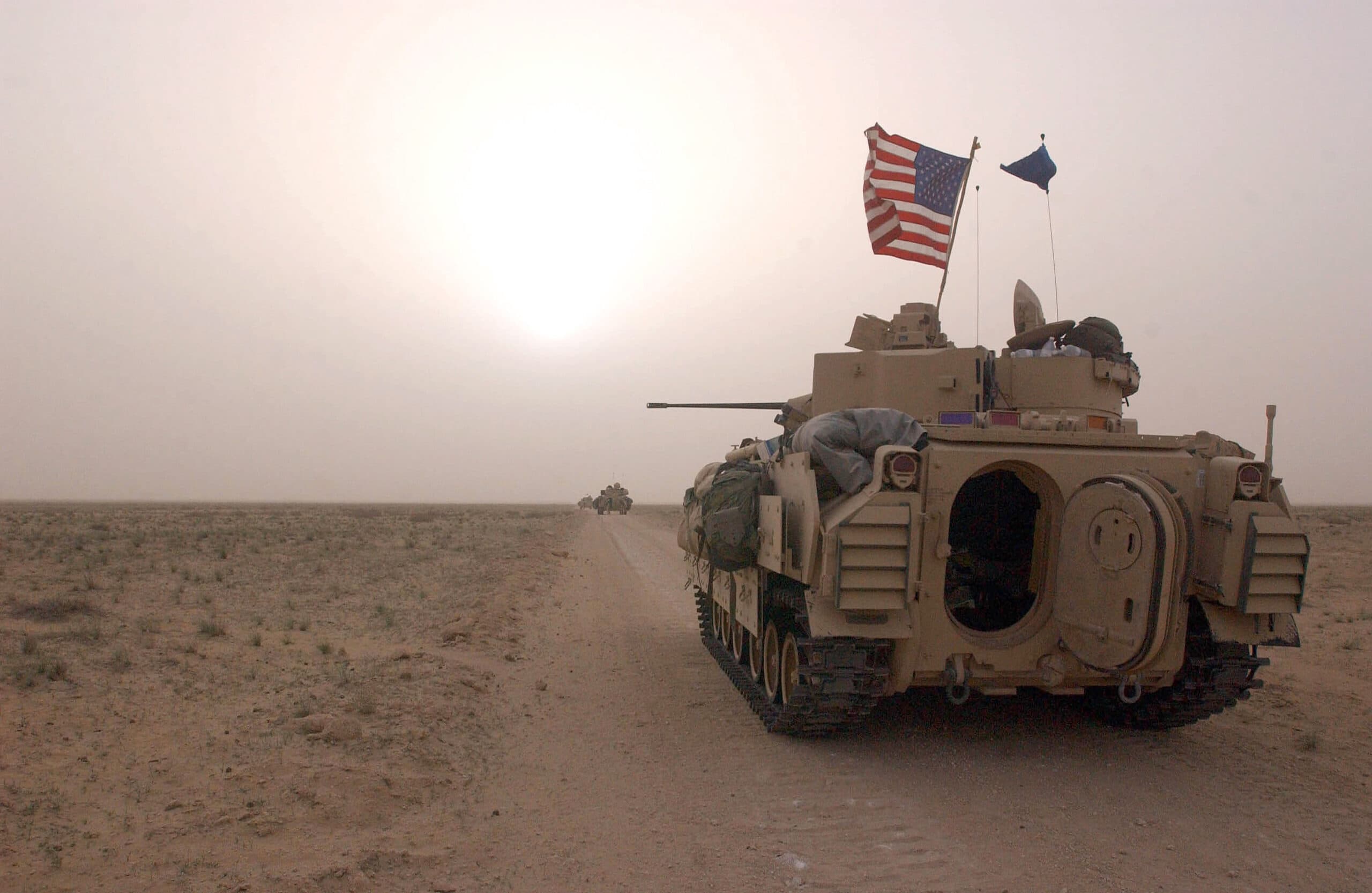 U.S. Army 3rd Division 3-7 Bradley fighting vehicles take up a position along a road March 19, 2003 inside the demilitarized zone between Kuwait and Iraq. (Scott Nelson/Getty Images)