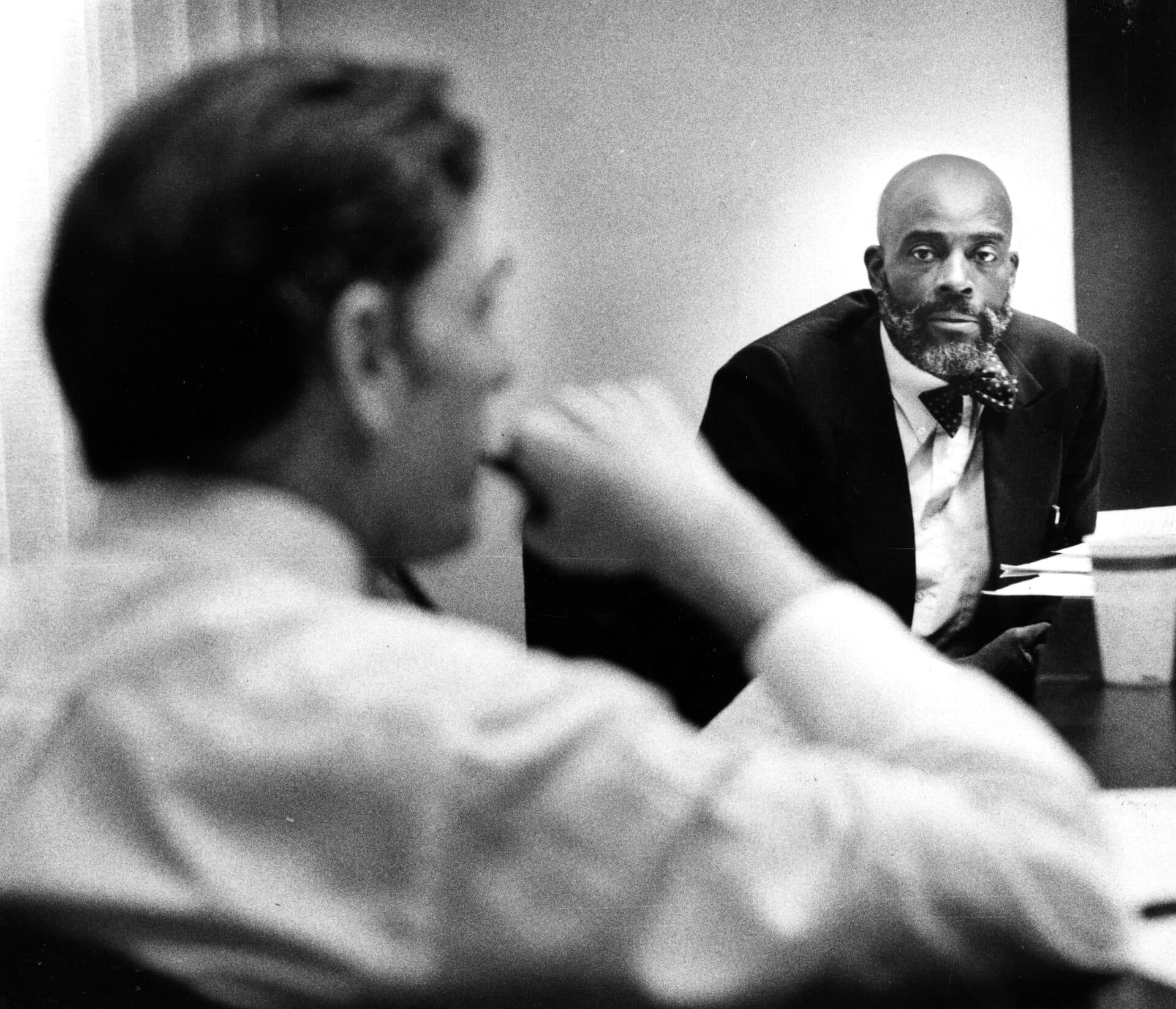 Boston mayoral candidate Mel King, right, listens to a question asked by opponent Ray Flynn in the Taylor Room at The Boston Globe in Boston on Oct. 27, 1983. (Photo by John Tlumacki/The Boston Globe via Getty Images)