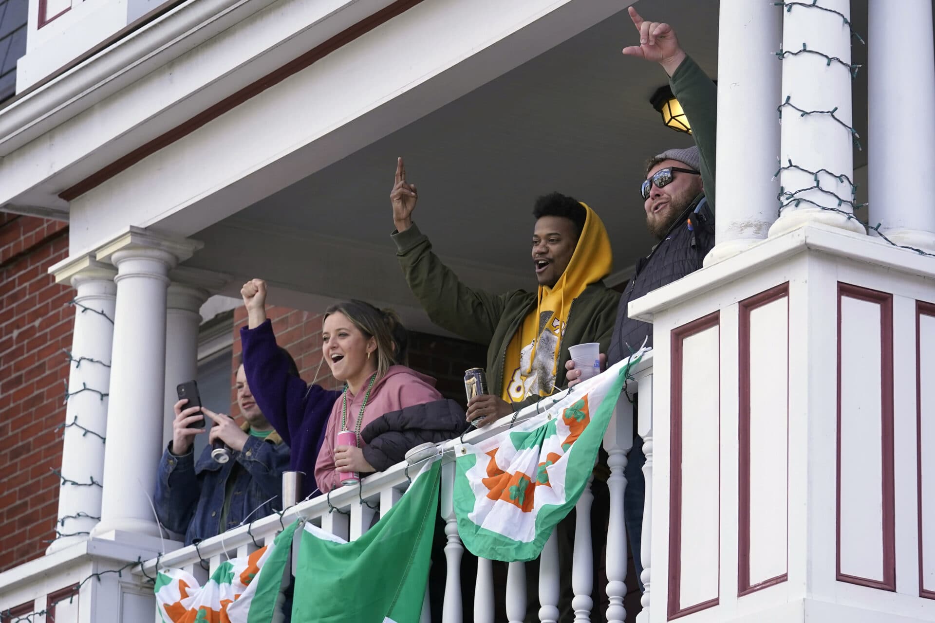 Spectators cheer during the annual St. Patrick's Day parade. (Steven Senne/AP)