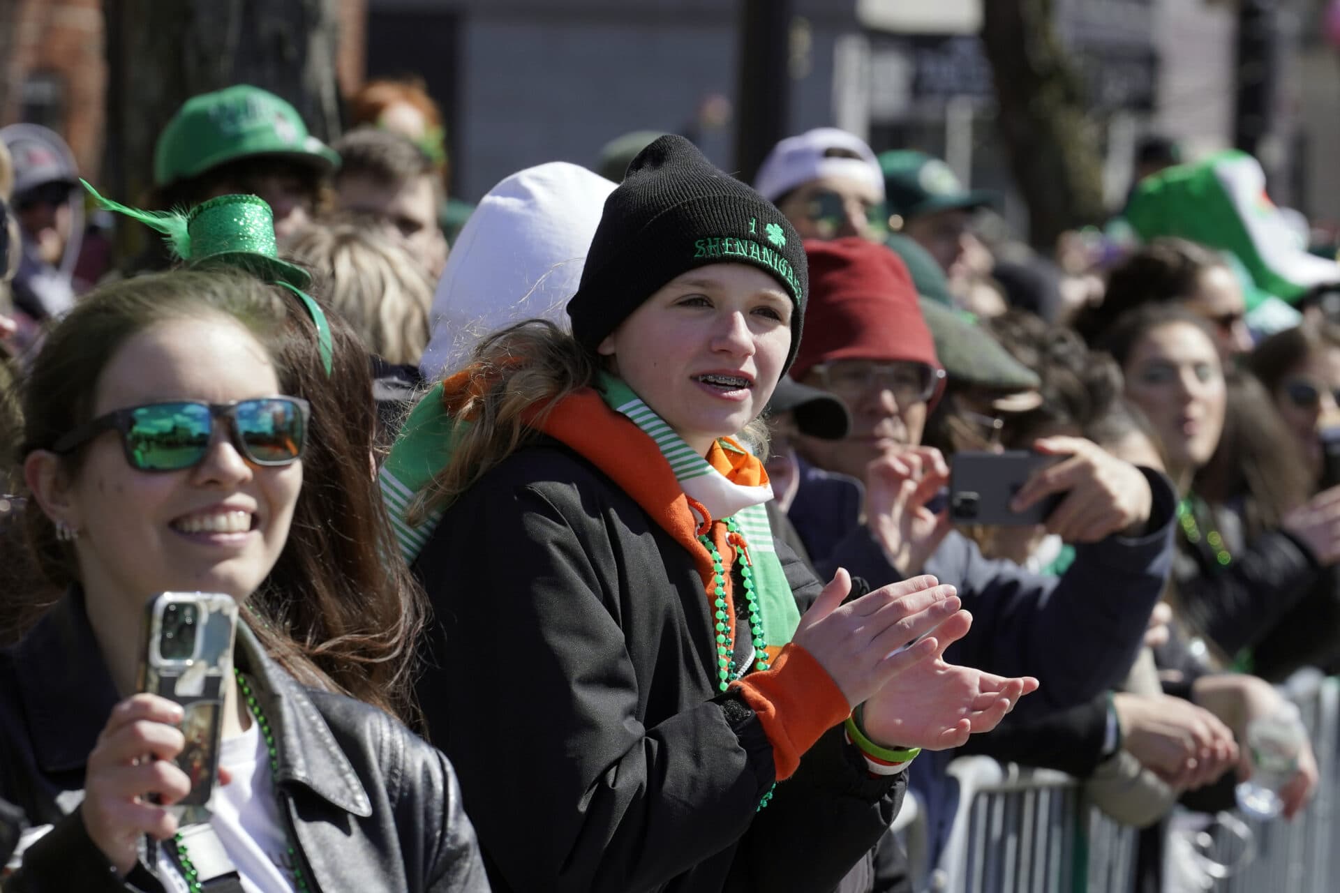 Spectators watch the annual St. Patrick's Day parade,, March 19, in Boston's South Boston neighborhood. (Steven Senne/AP)