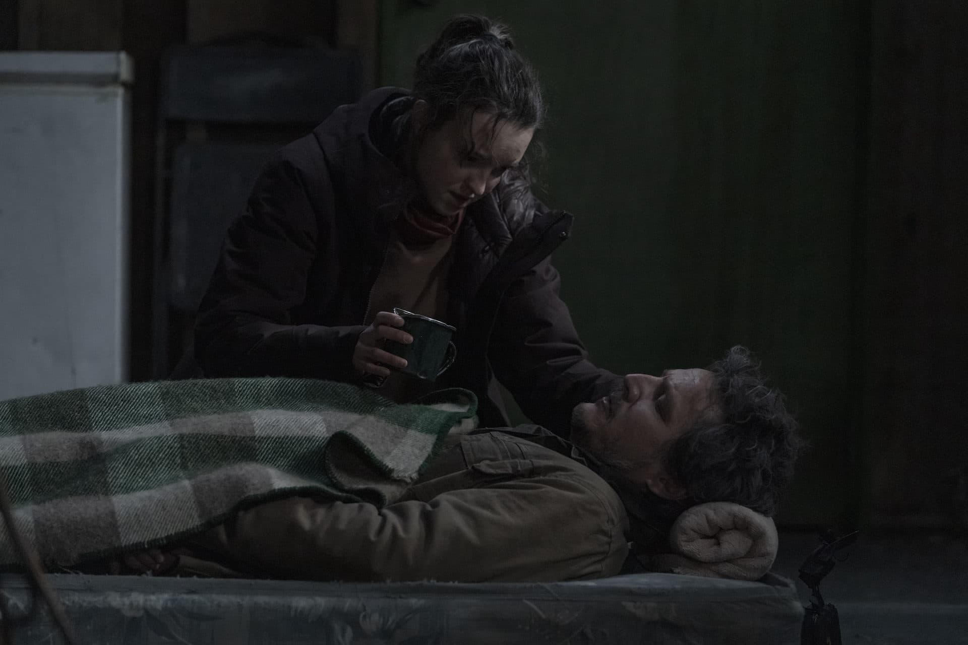 Ellie (played by Bella Ramsay) tends to a wounded Joel (Pedro Pascal) in episode 8 of "The Last of Us." (Courtesy of HBO)