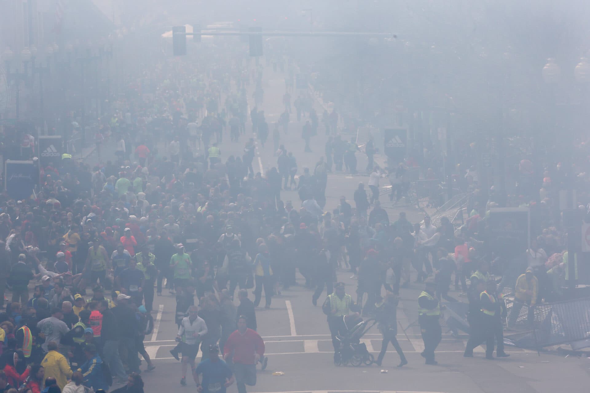 There was smoke and panic in the street as emergency personnel responded to two explosions near the finish line of the Boston Marathon in 2013. (David L. Ryan/The Boston Globe via Getty Images)