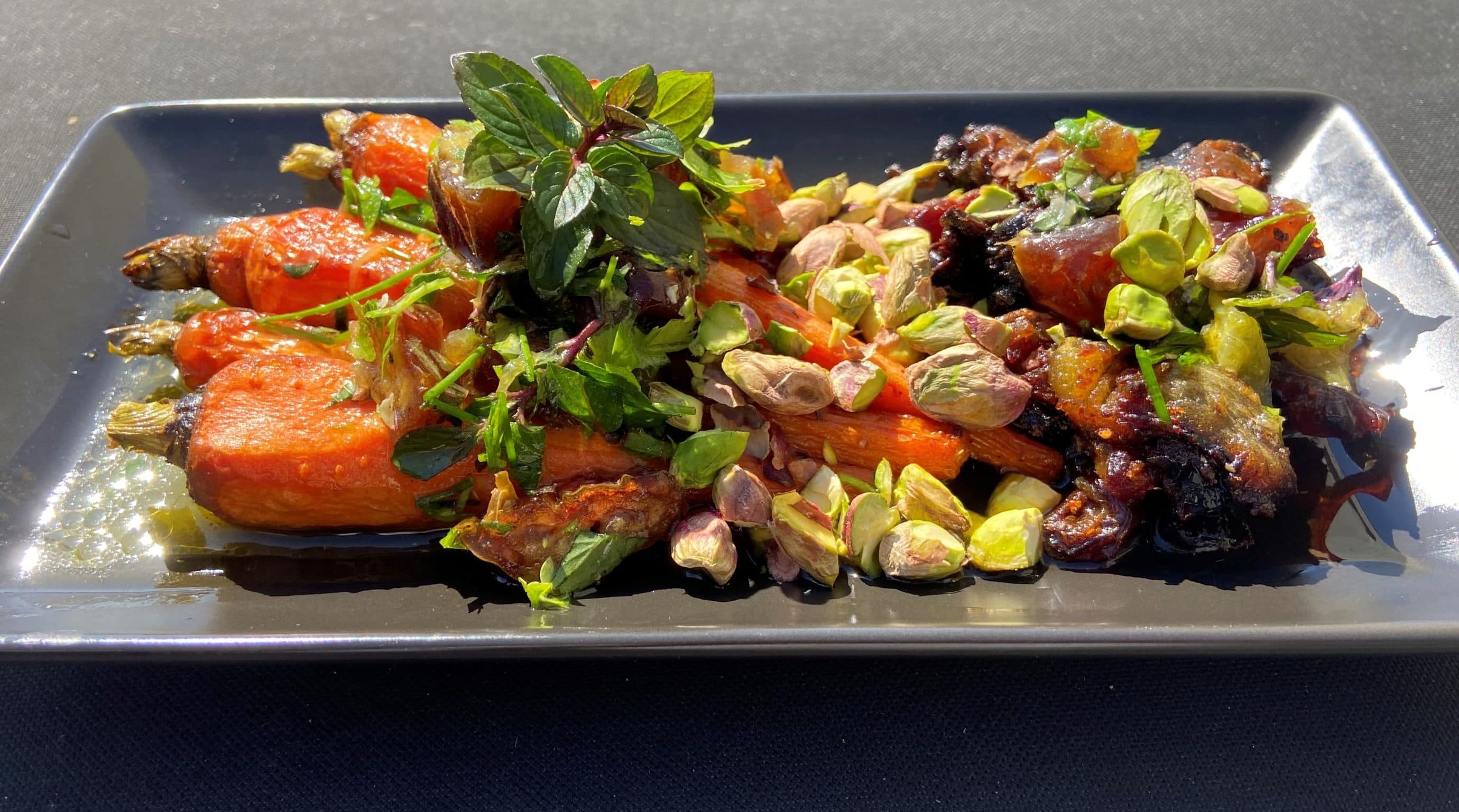 Roast carrots and dates with a date-orange-mint vinaigrette and pistachios. (Kathy Gunst/Here &amp; Now)