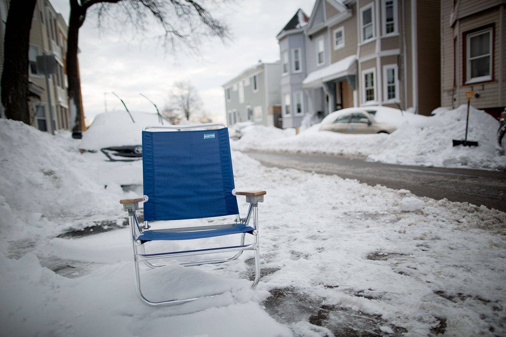 This blue beach chair marks a parking space on I Street in South Boston. (Robin Lubbock/WBUR)