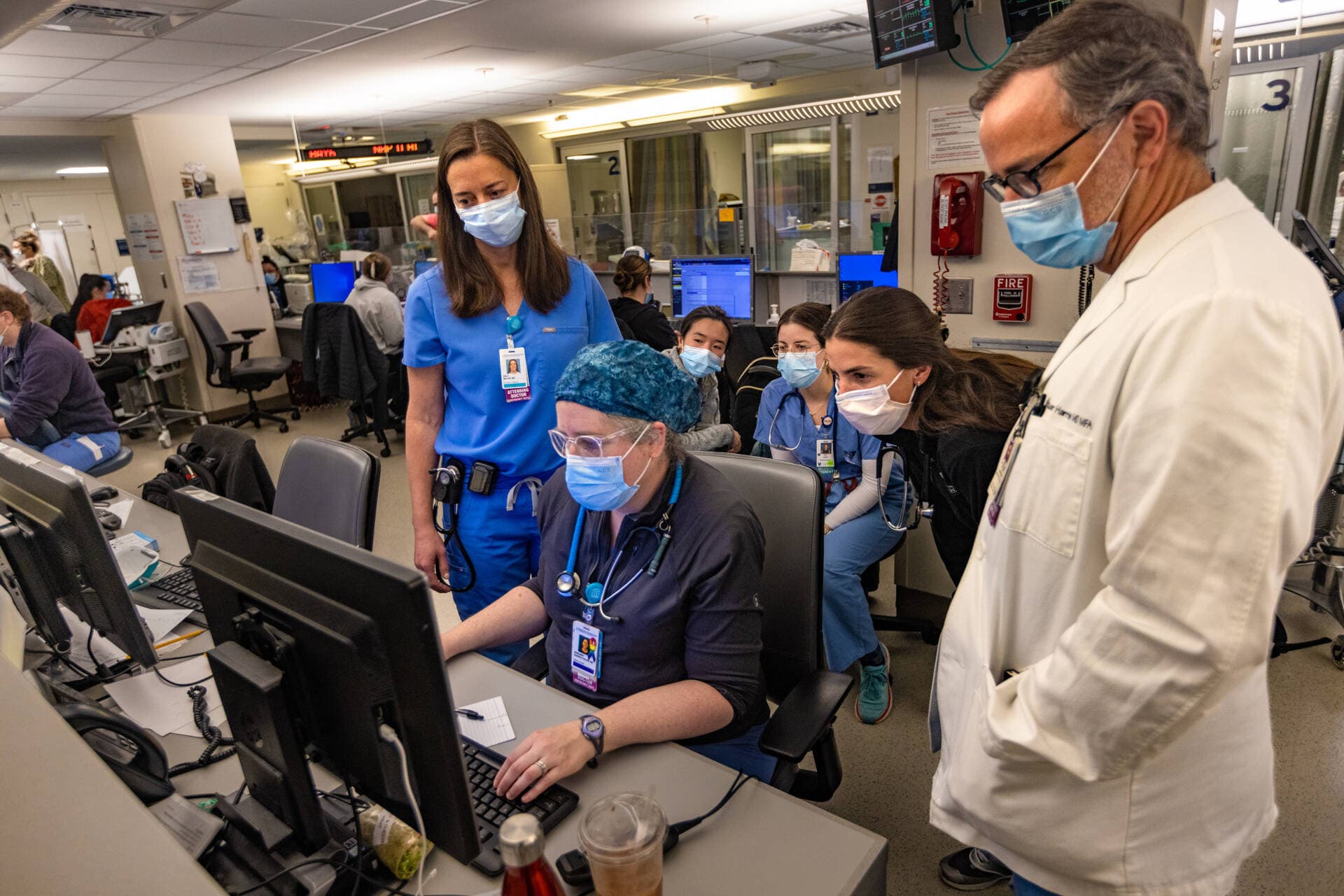 Dr. Emily Miller, left, working with the team in the Department of Emergency Medicine at Massachusetts General Hospital. (Jesse Costa/WBUR)