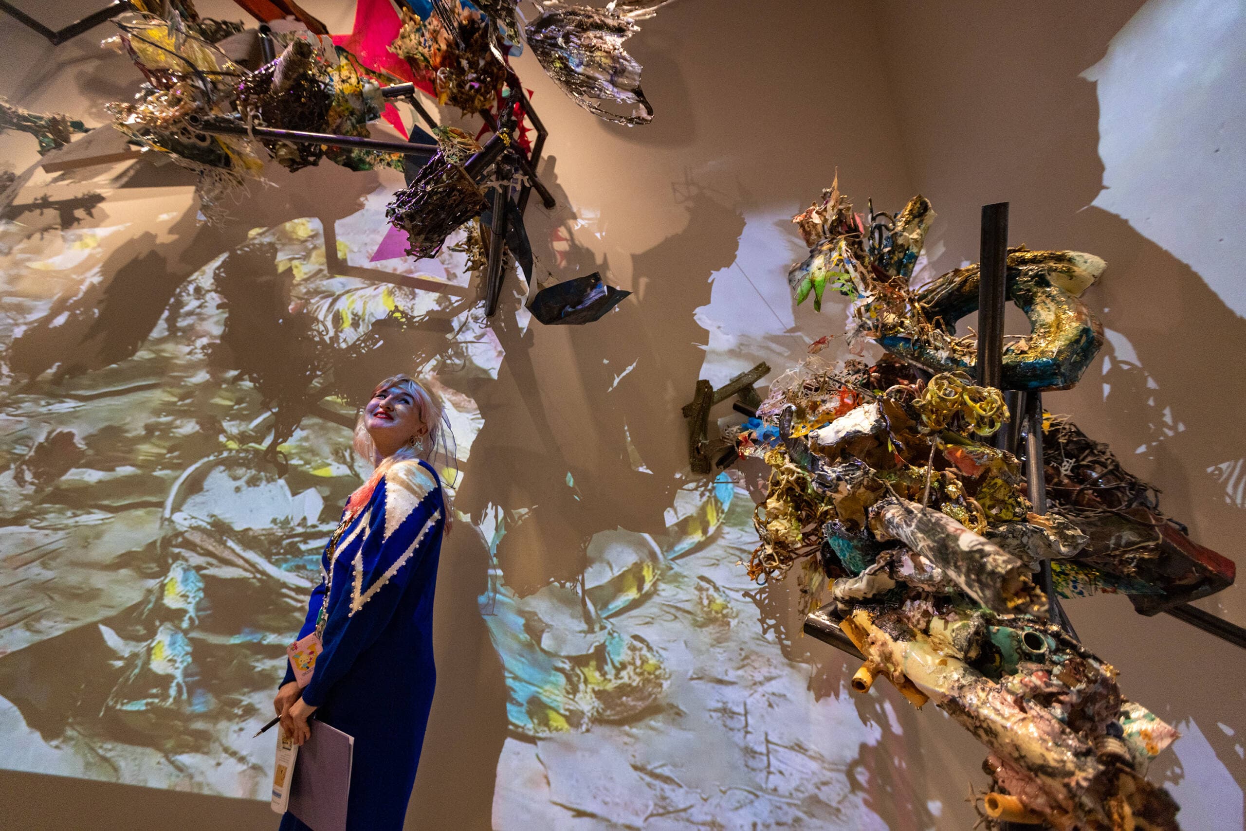 Kendall DeBoer, assistant curator of contemporary art at the MFA, walks through “Boru Sibaso Paet, on the foam of the primordial sea,” Linda Sormin’s interactive mixed-media installation at the "Hokusai: Inspiration and Influence" show. (Jesse Costa/WBUR)